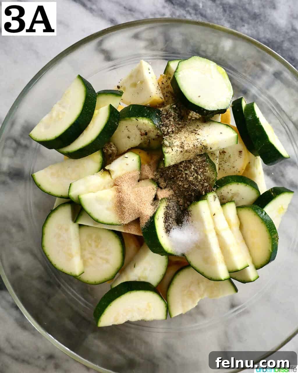 Air Fryer Zucchini and Squash Medley 7 Mixing zucchini and yellow squash with seasonings