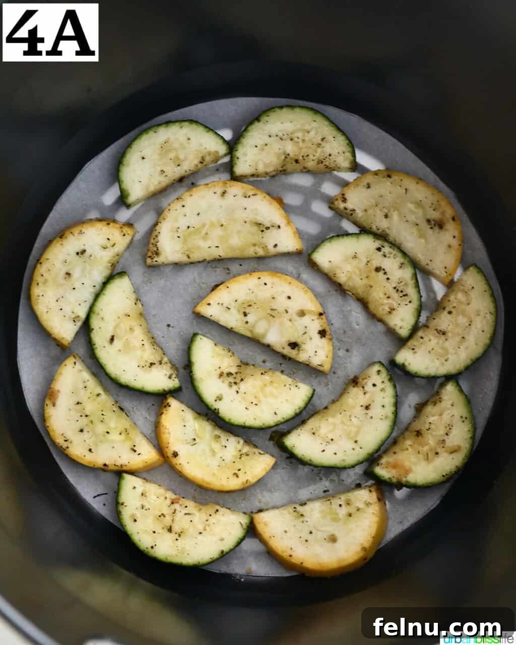 Air Fryer Zucchini and Squash Medley 9 Zucchini and yellow squash in an air fryer basket
