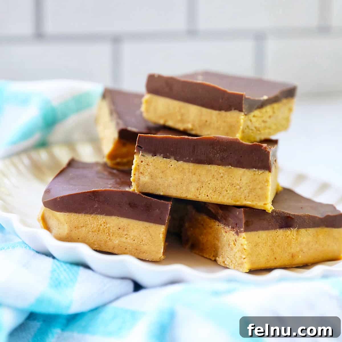 Decadent No-Bake Chocolate Peanut Butter Bars, sliced and ready to serve.