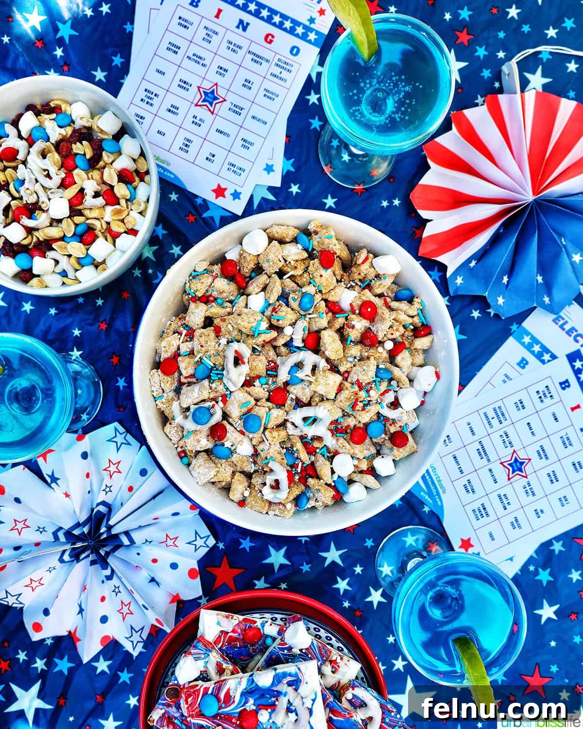 Effortlessly Delicious Patriotic Puppy Chow 16 Election Night Party setting with patriotic puppy chow, election bingo cards, decorations, red, white and blue trail mix, and patriotic chocolate bark, alongside blue wave cocktails.