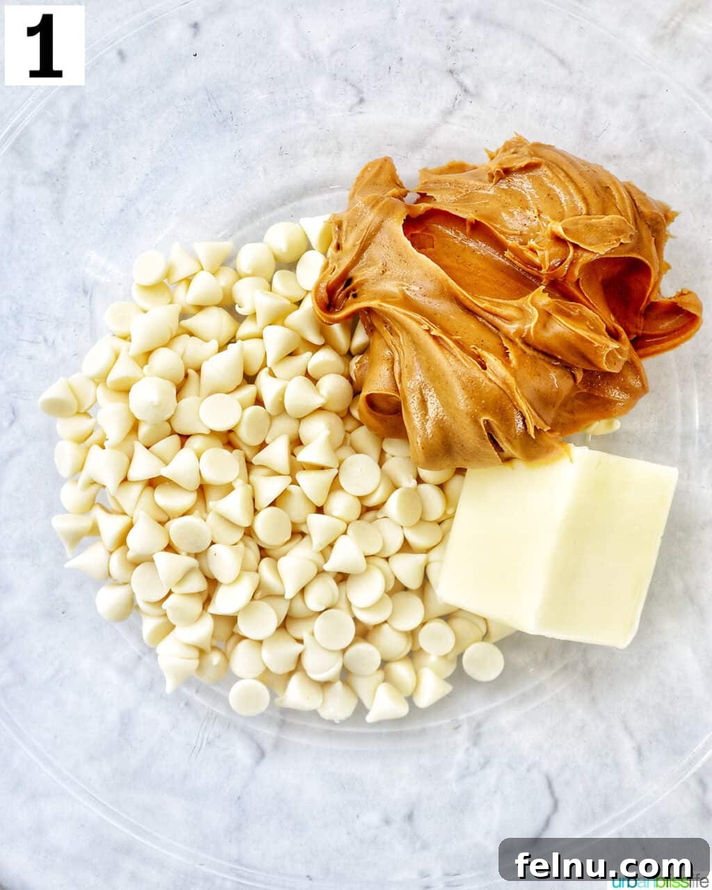 Effortlessly Delicious Patriotic Puppy Chow 5 Peanut butter, white chocolate chips, and unsalted butter in a large microwave-safe bowl.