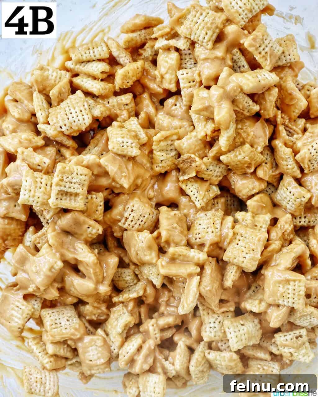 Effortlessly Delicious Patriotic Puppy Chow 9 Rice Chex cereal fully coated with the white chocolate and peanut butter mixture.