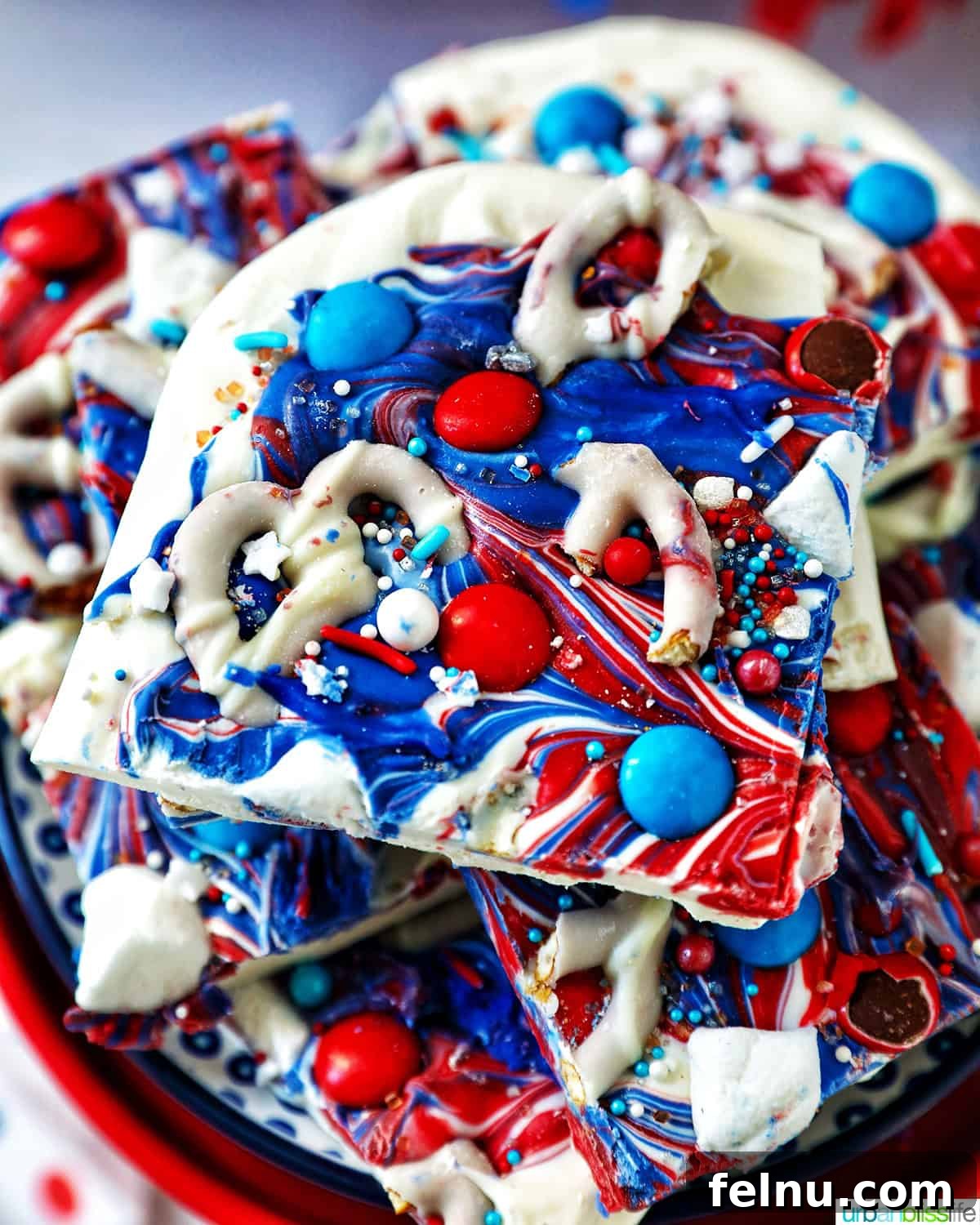 Fourth of July Freedom Bark 2 overhead view of a stack of red, white, and blue bark, showcasing its patriotic colors and various toppings.