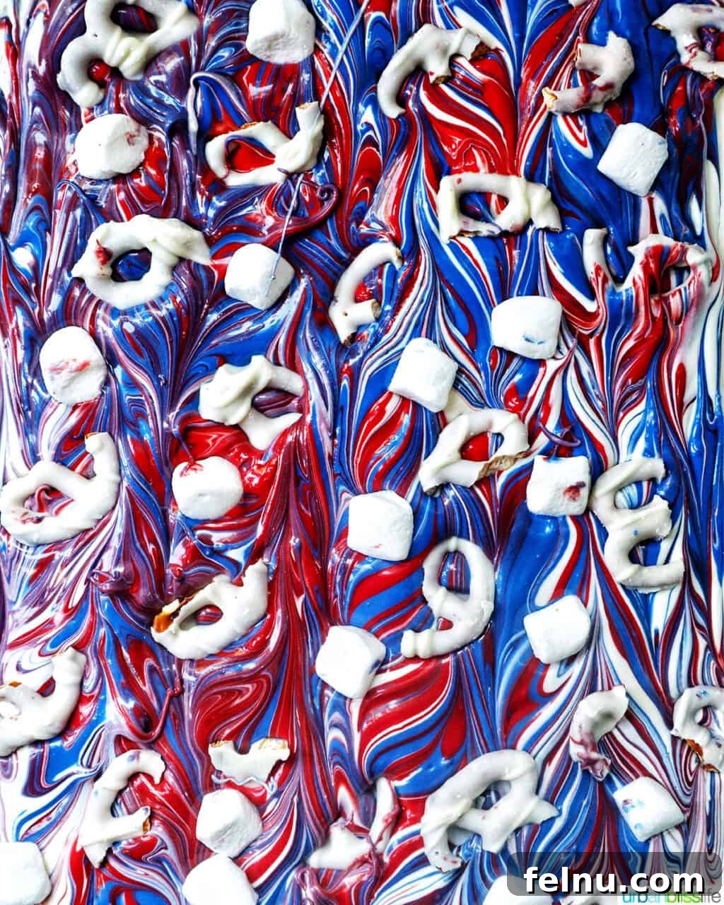 Fourth of July Freedom Bark 12 A wide shot of the patriotic red, white, and blue chocolate bark, with its vibrant colors swirled and ready for the next step.