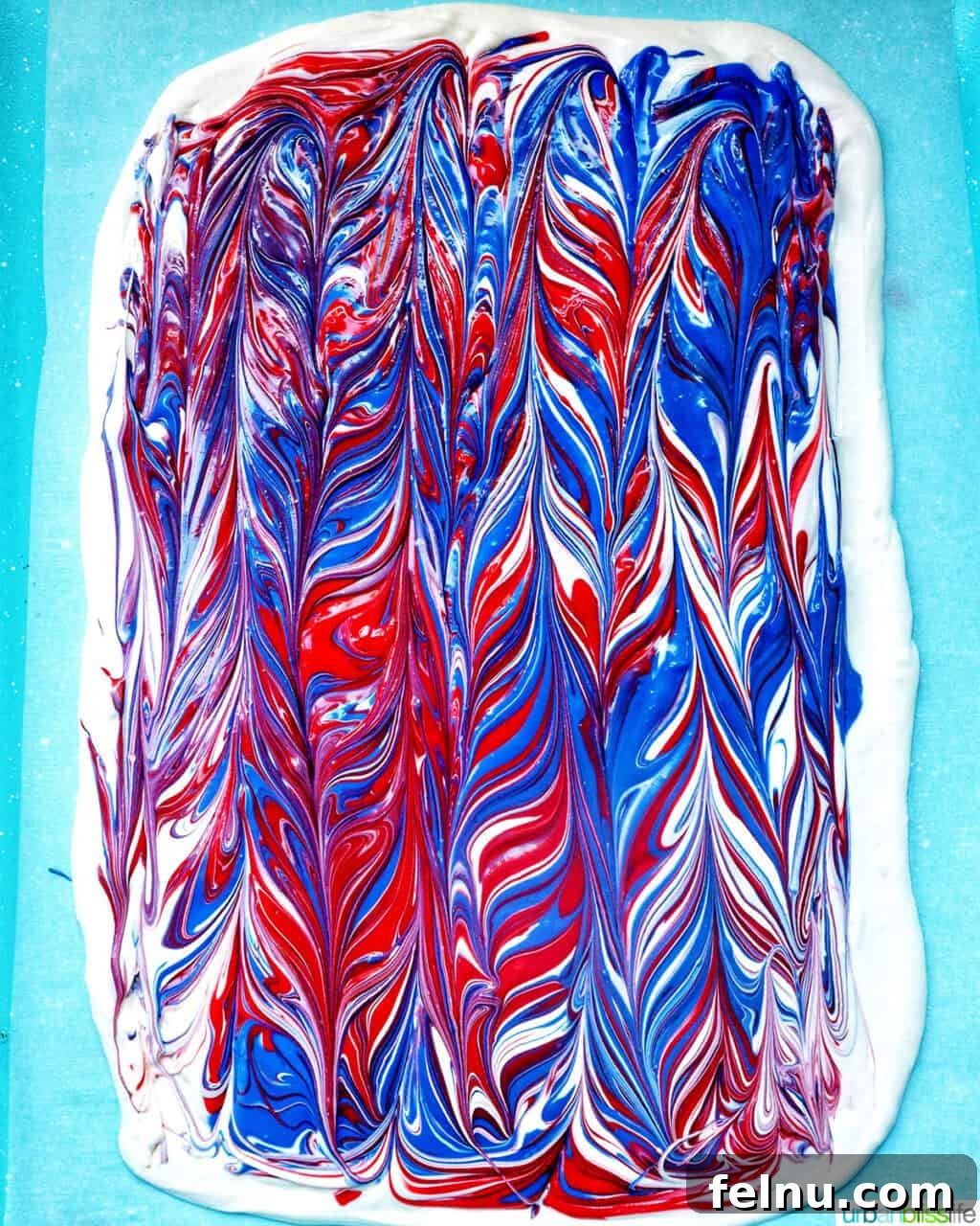 Fourth of July Freedom Bark 10 The fully swirled red, white, and blue bark on a baking sheet, showcasing a completed marbled design before toppings are added.