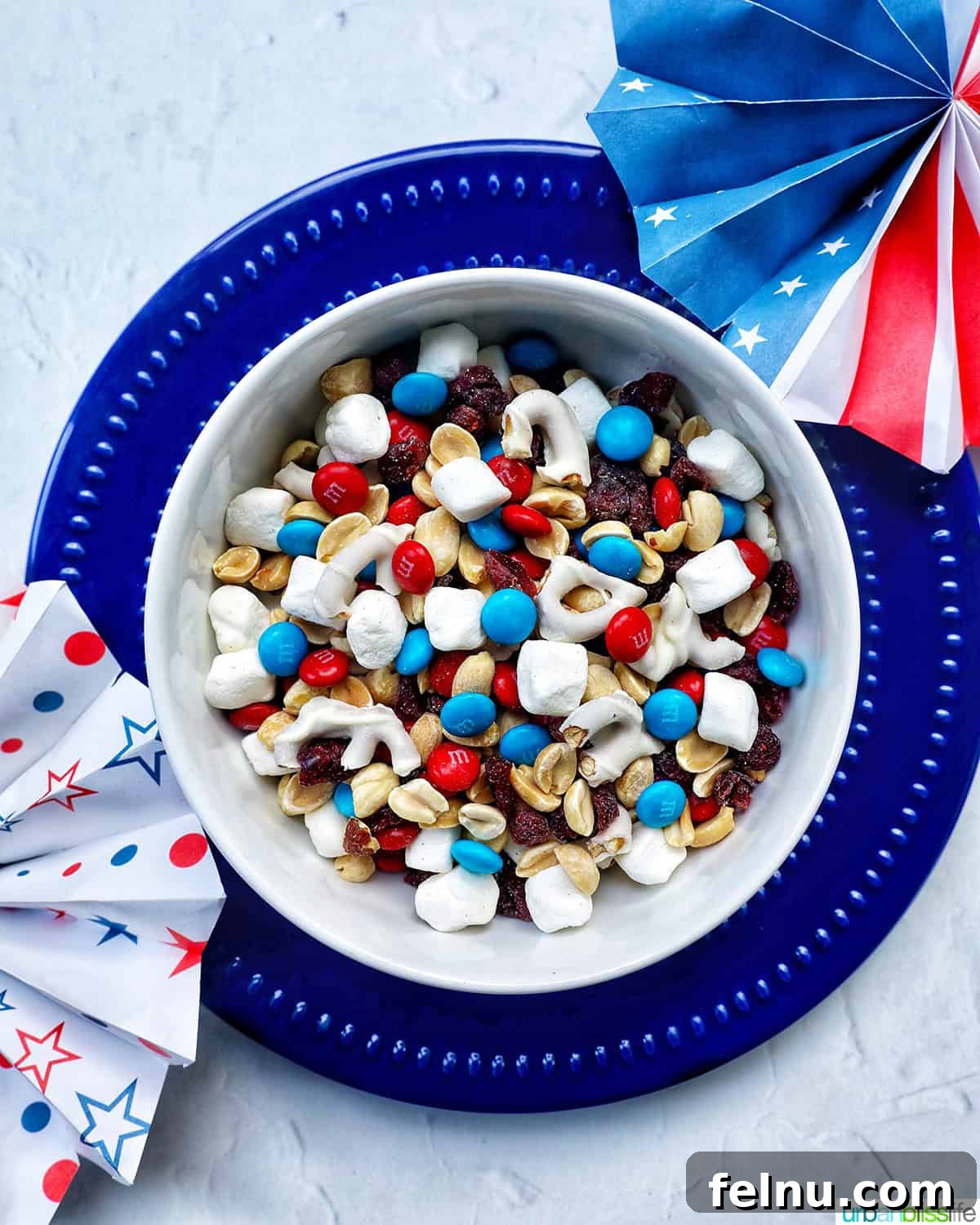 Stars and Stripes Snack Blend 7 An inviting bowl of red, white, and blue trail mix, ready for snacking.