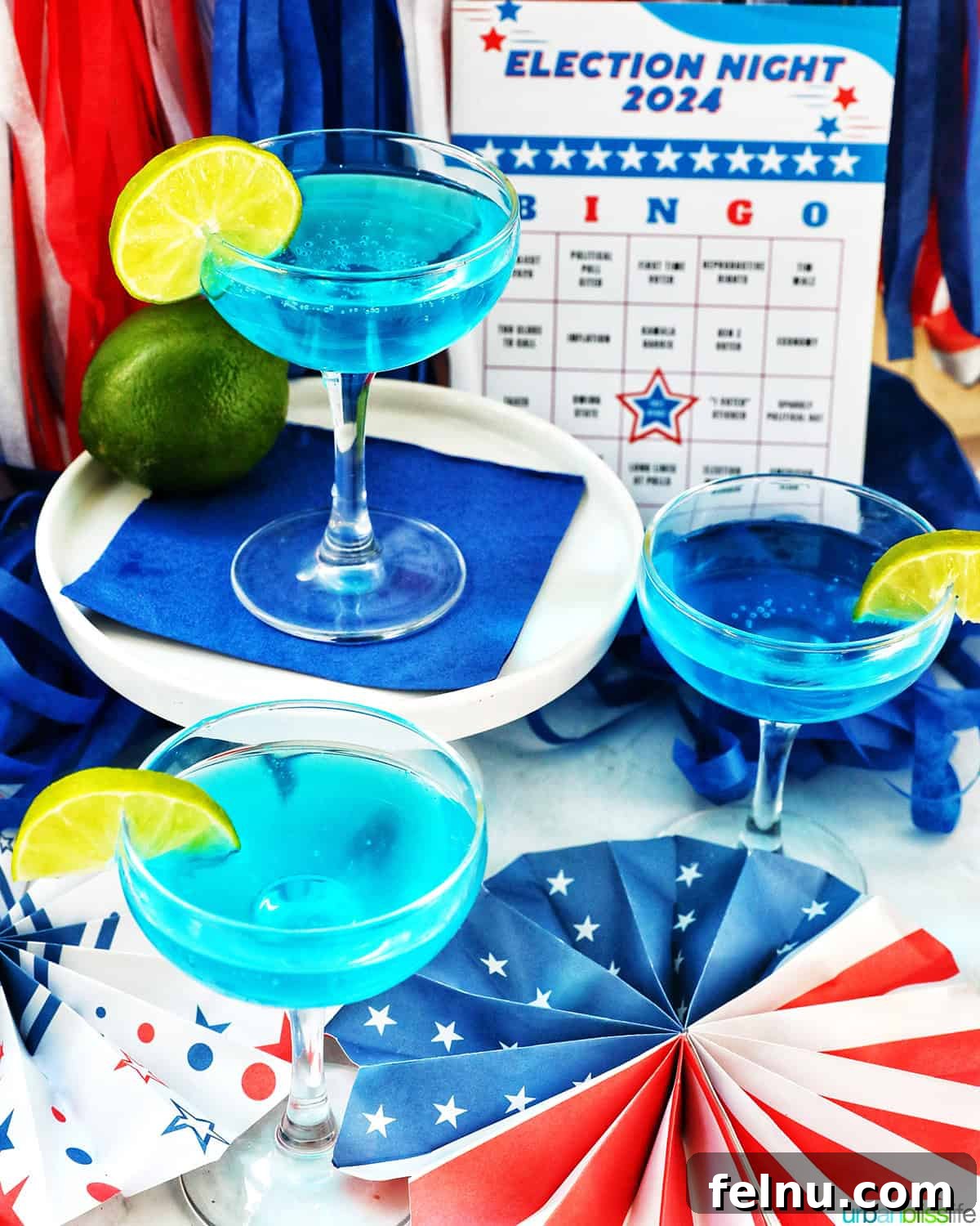 Three glasses of Blue Wave Cocktails with red, white and blue election party decorations.