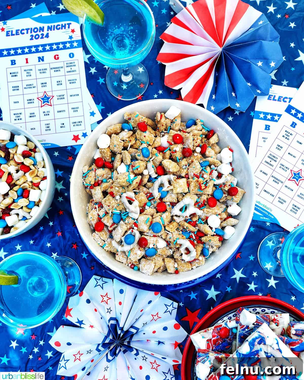 Ultimate Election Night Celebration Guide 2 Election Night Party setting with patriotic puppy chow, election bingo cards, decorations, red, white and blue trail mix, and red, white, and blue bark and blue wave cocktails.