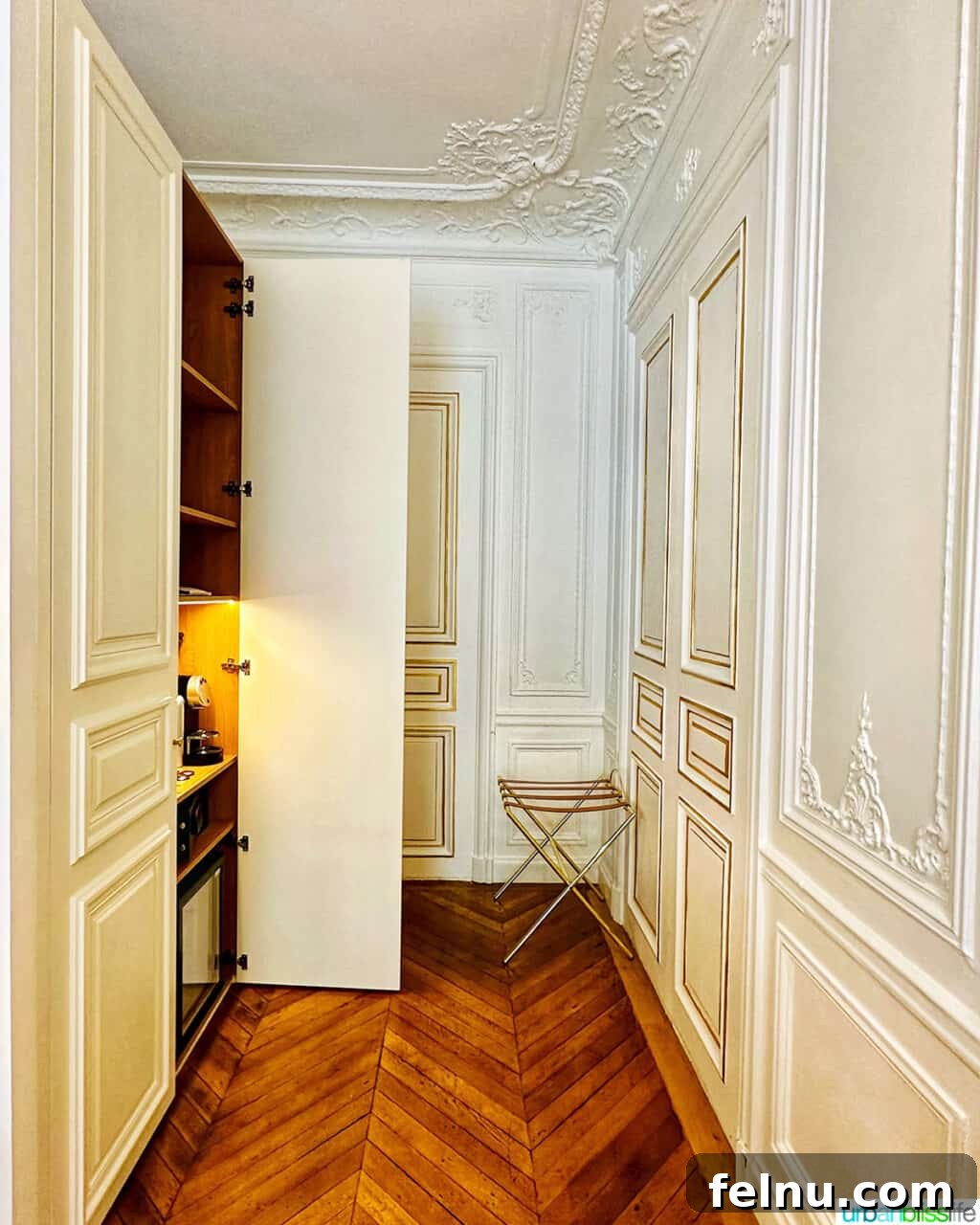 Minibar area and closet in suite at Hotel Alfred Sommier in Paris
