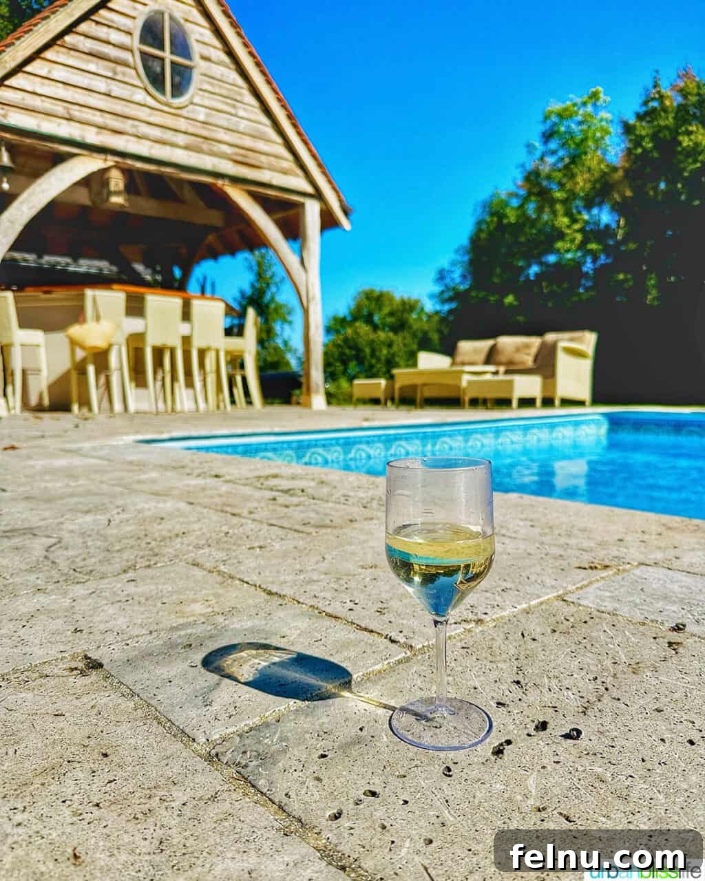 Wine by the pool at Chateau de Valcreuse in La Roche-Posay, France