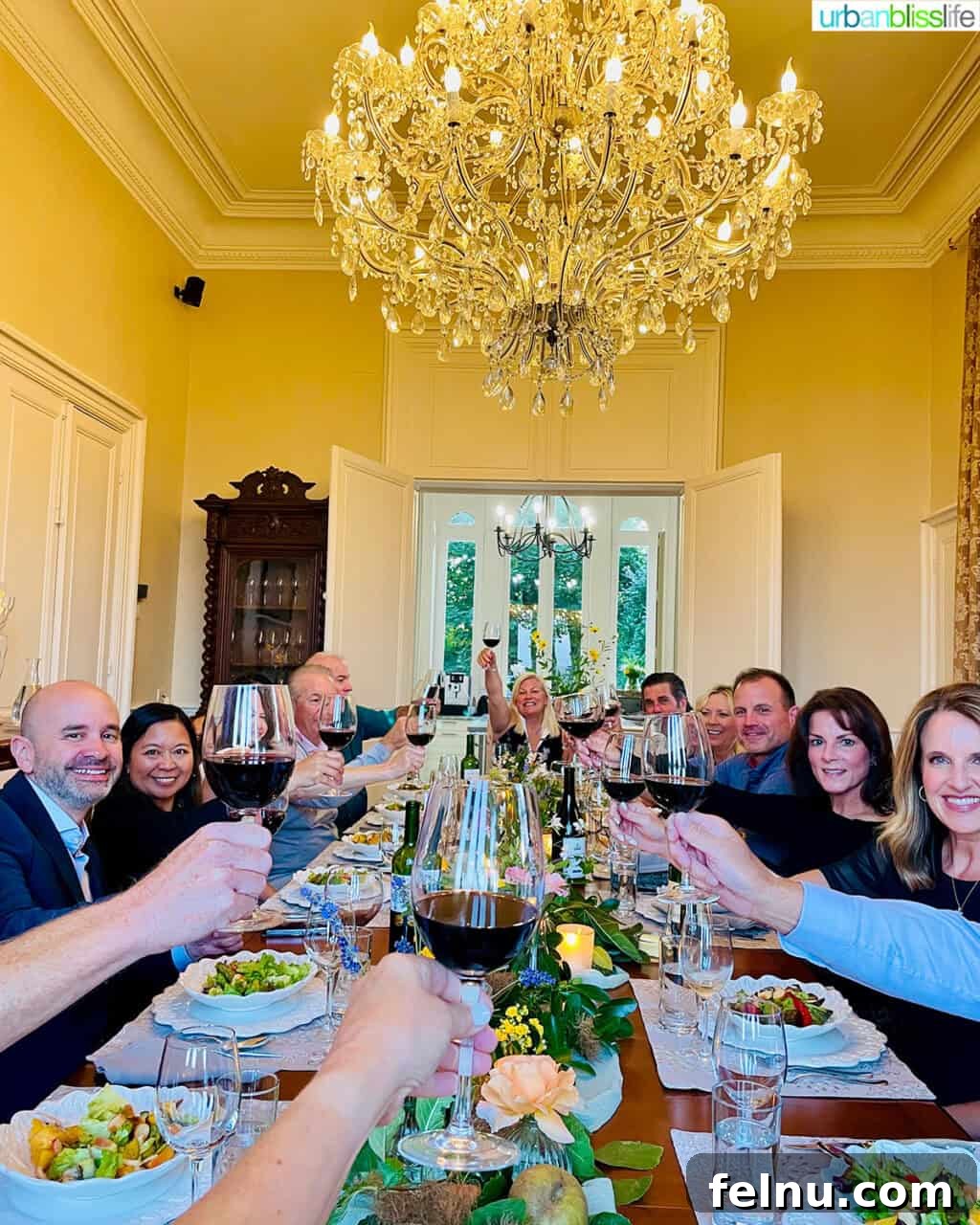 Cheers at dinner table at Chateau de Valcreuse in La Roche-Posay, France