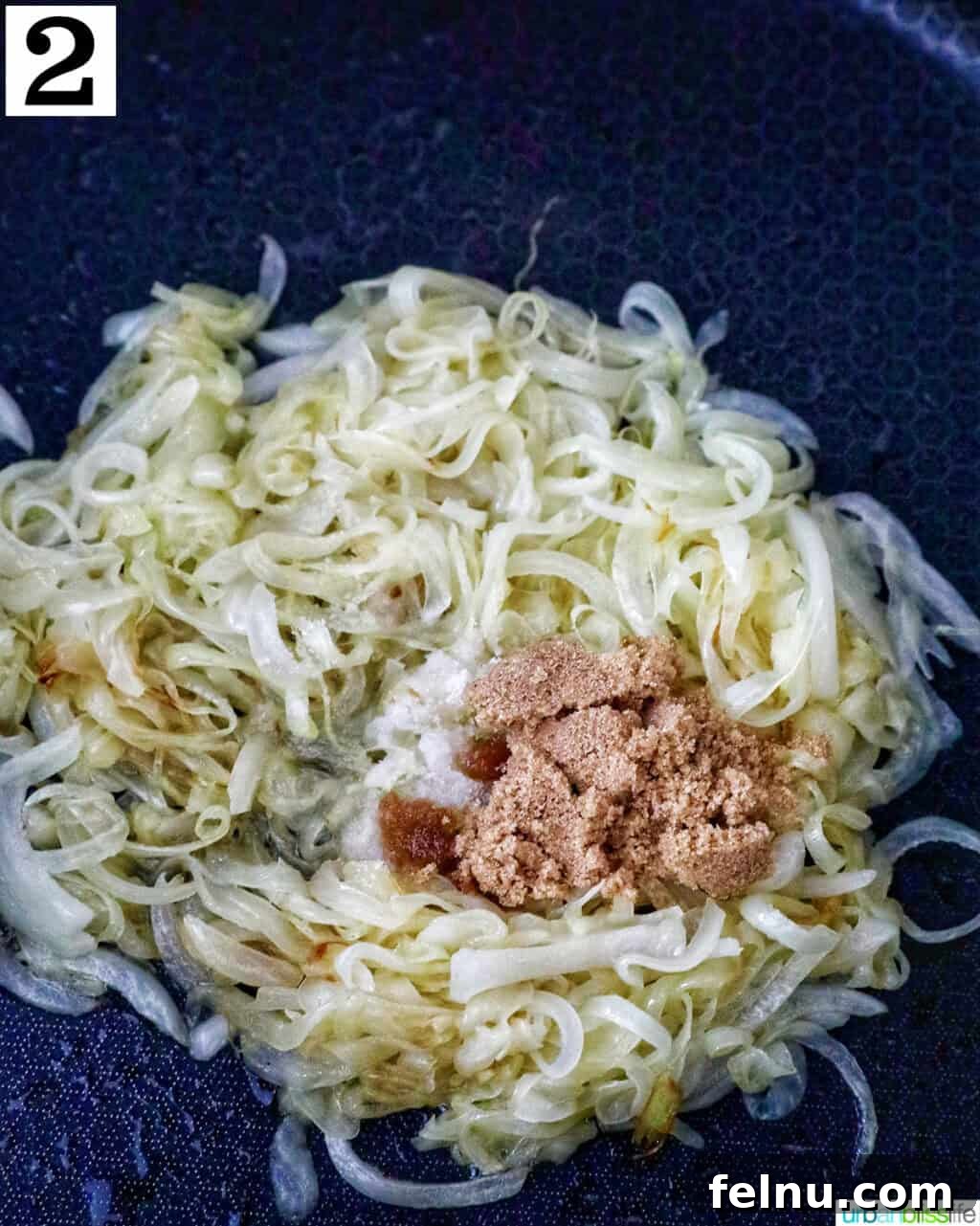 Golden Onion and Chevre Morsels 6 Sliced onions continuing to cook in a skillet with brown sugar and sherry vinegar added for caramelization.