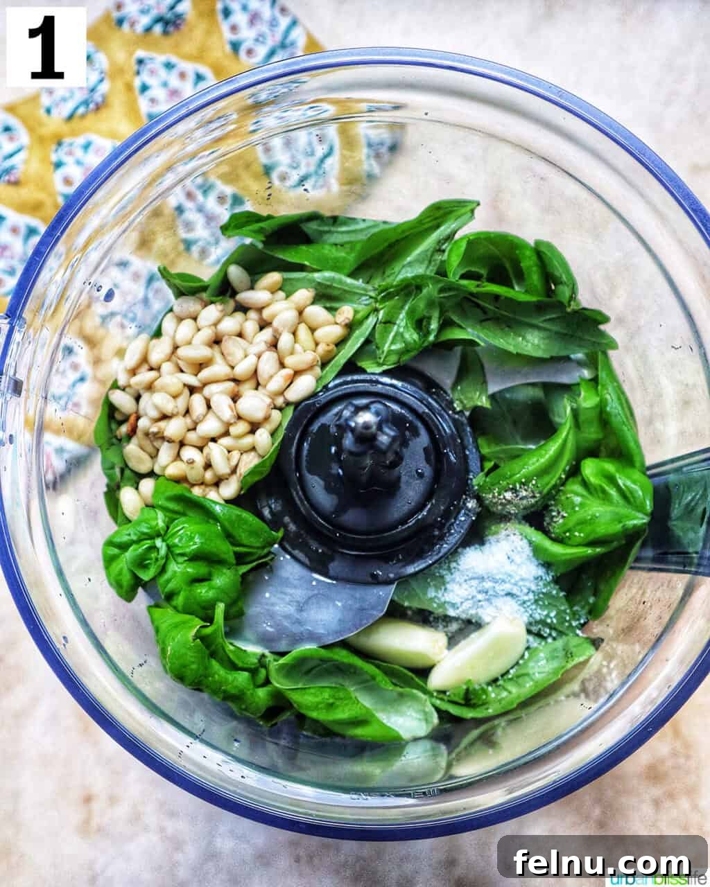 Homemade Basil Pesto: A Burst of Summer Flavor 5 Ingredients for pesto in a food processor before blending