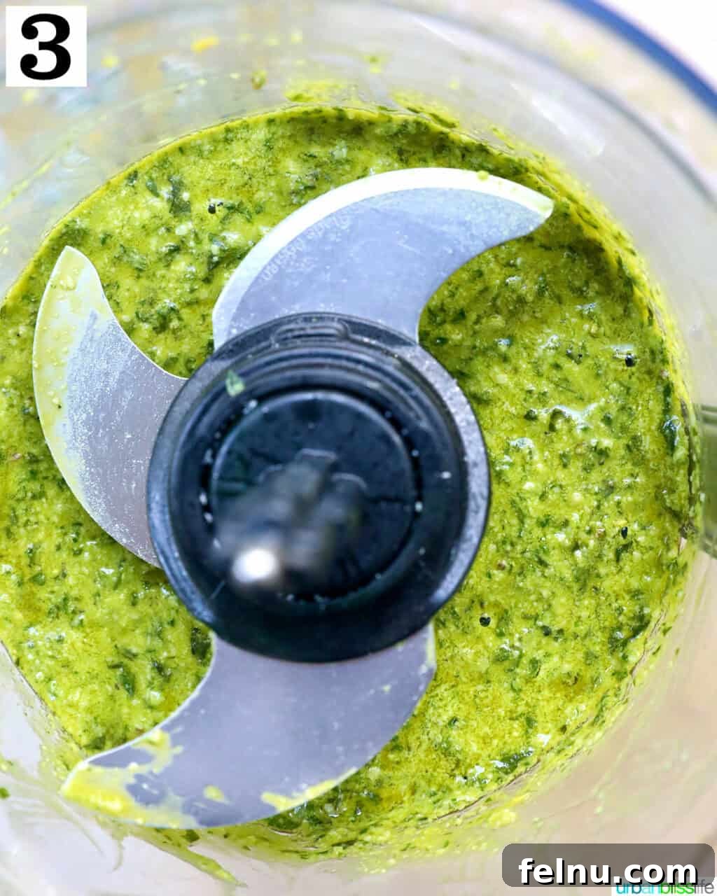 Homemade Basil Pesto: A Burst of Summer Flavor 7 Finished pesto in a food processor, ready to be enjoyed