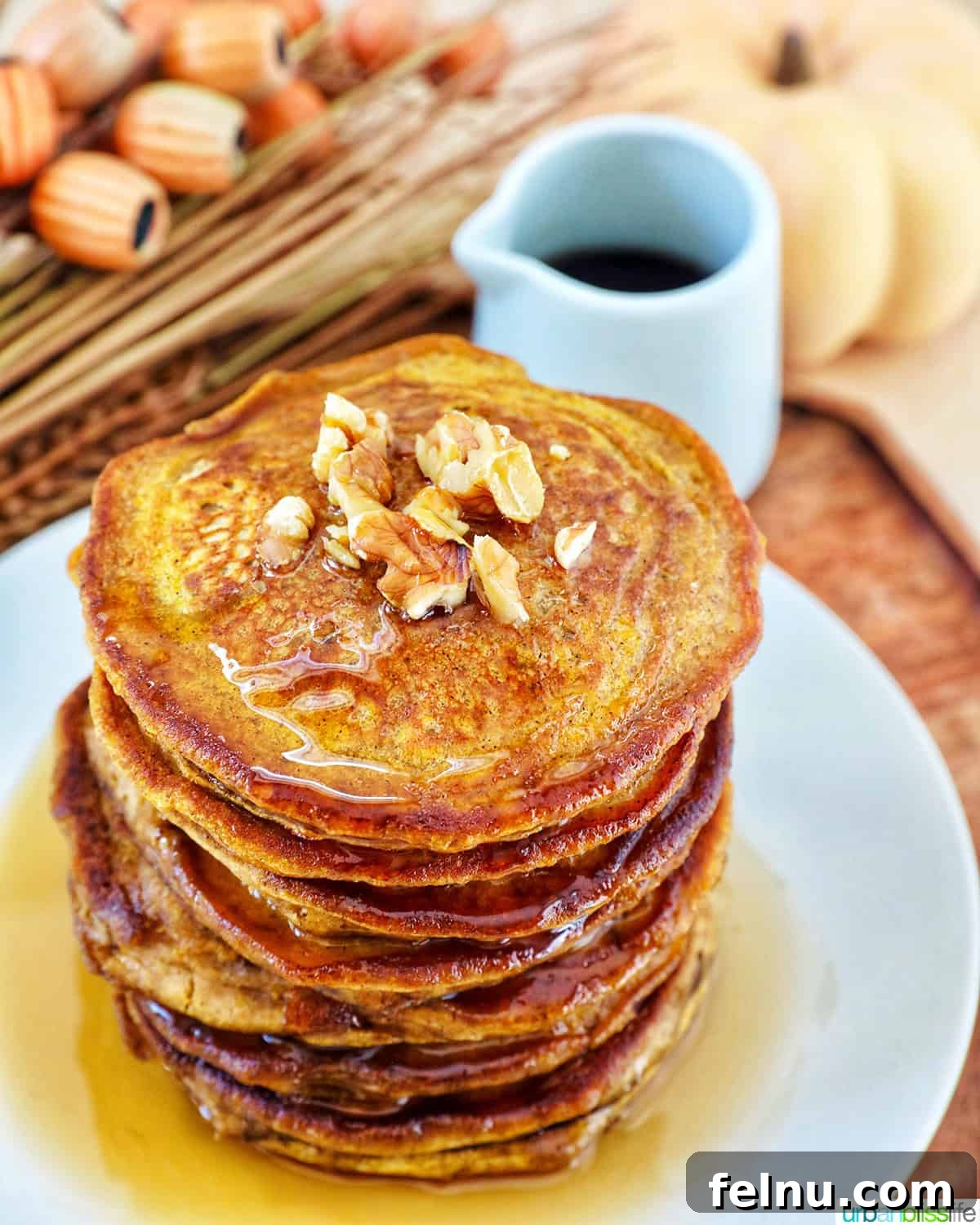 A beautiful stack of pumpkin spice pancakes, ready to be enjoyed.
