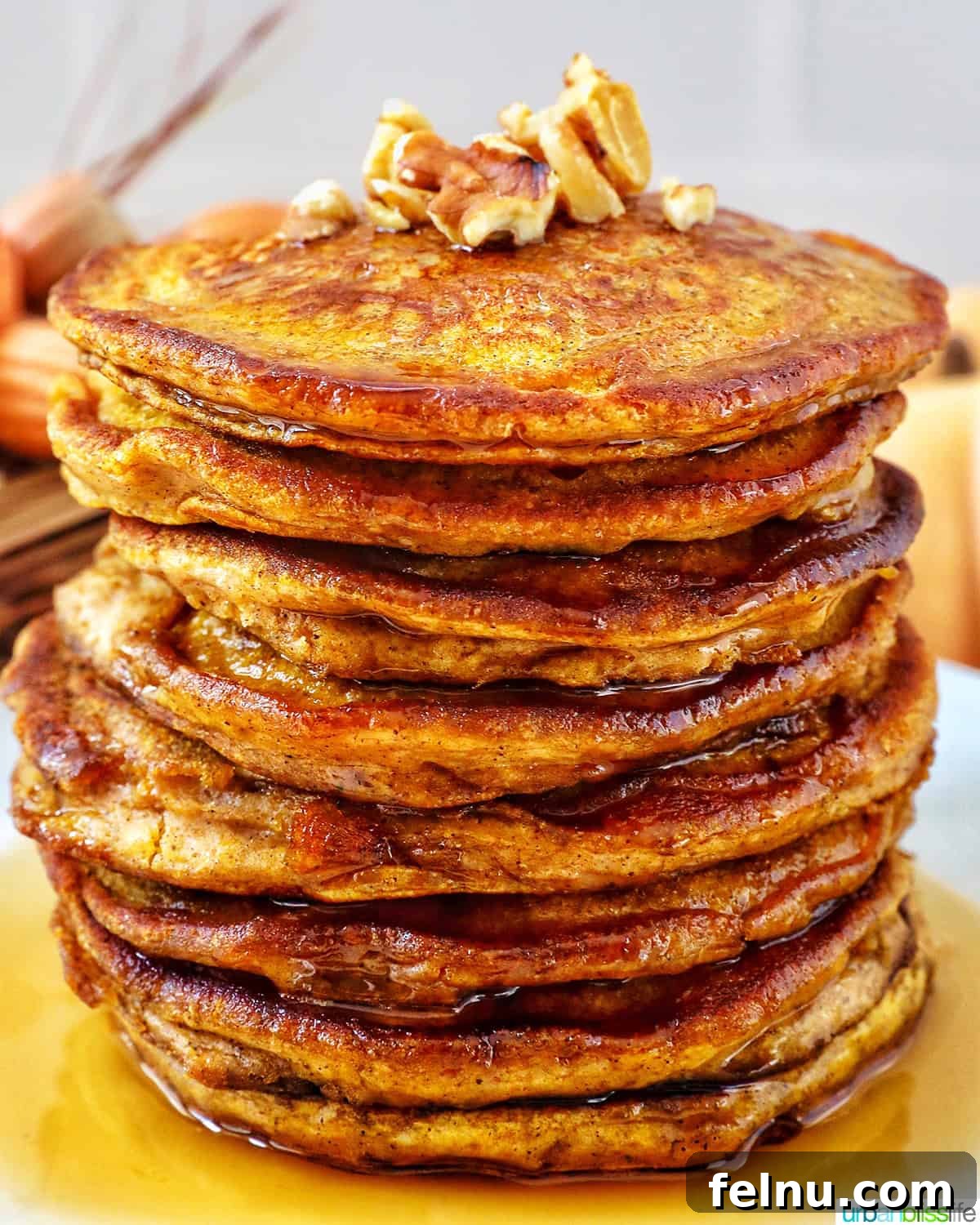 Close-up stack of warm and fluffy pumpkin spice pancakes.