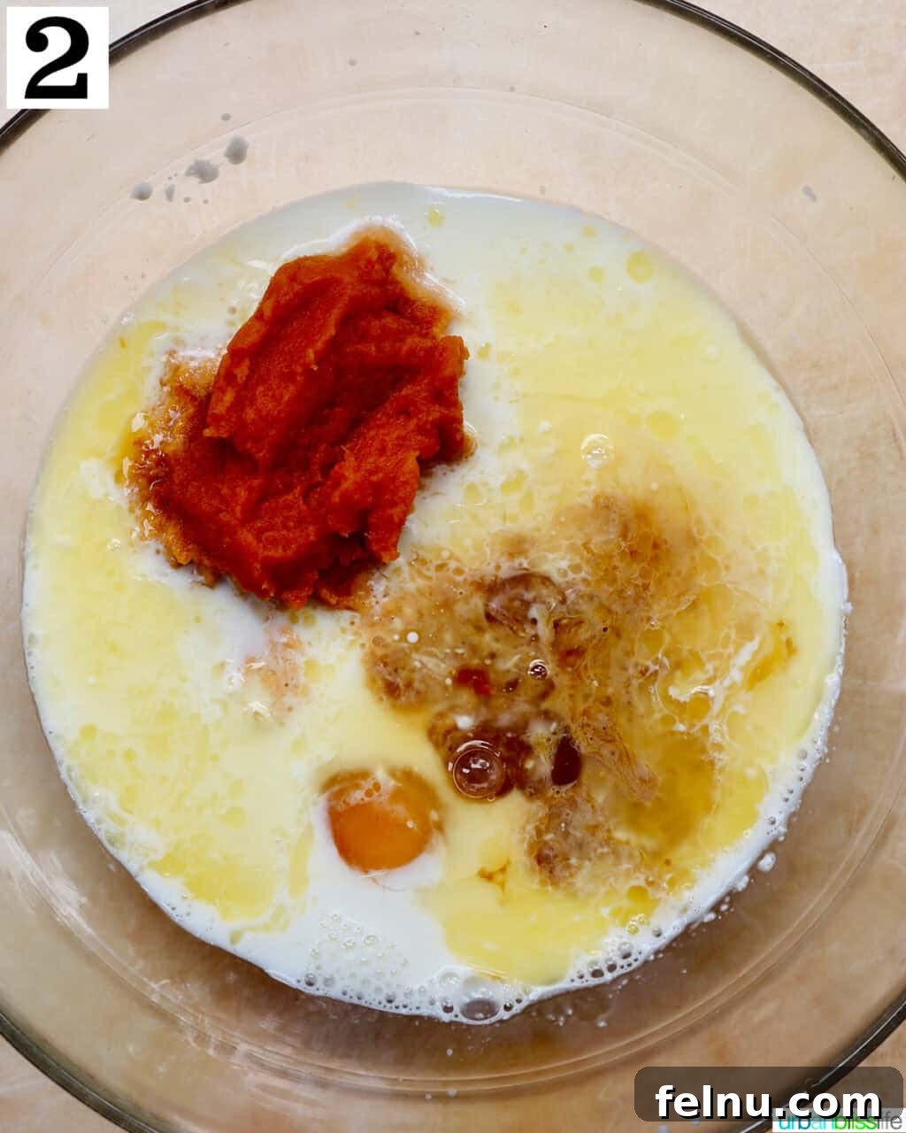 Wet ingredients (buttermilk, pumpkin, egg, butter) in a mixing bowl.