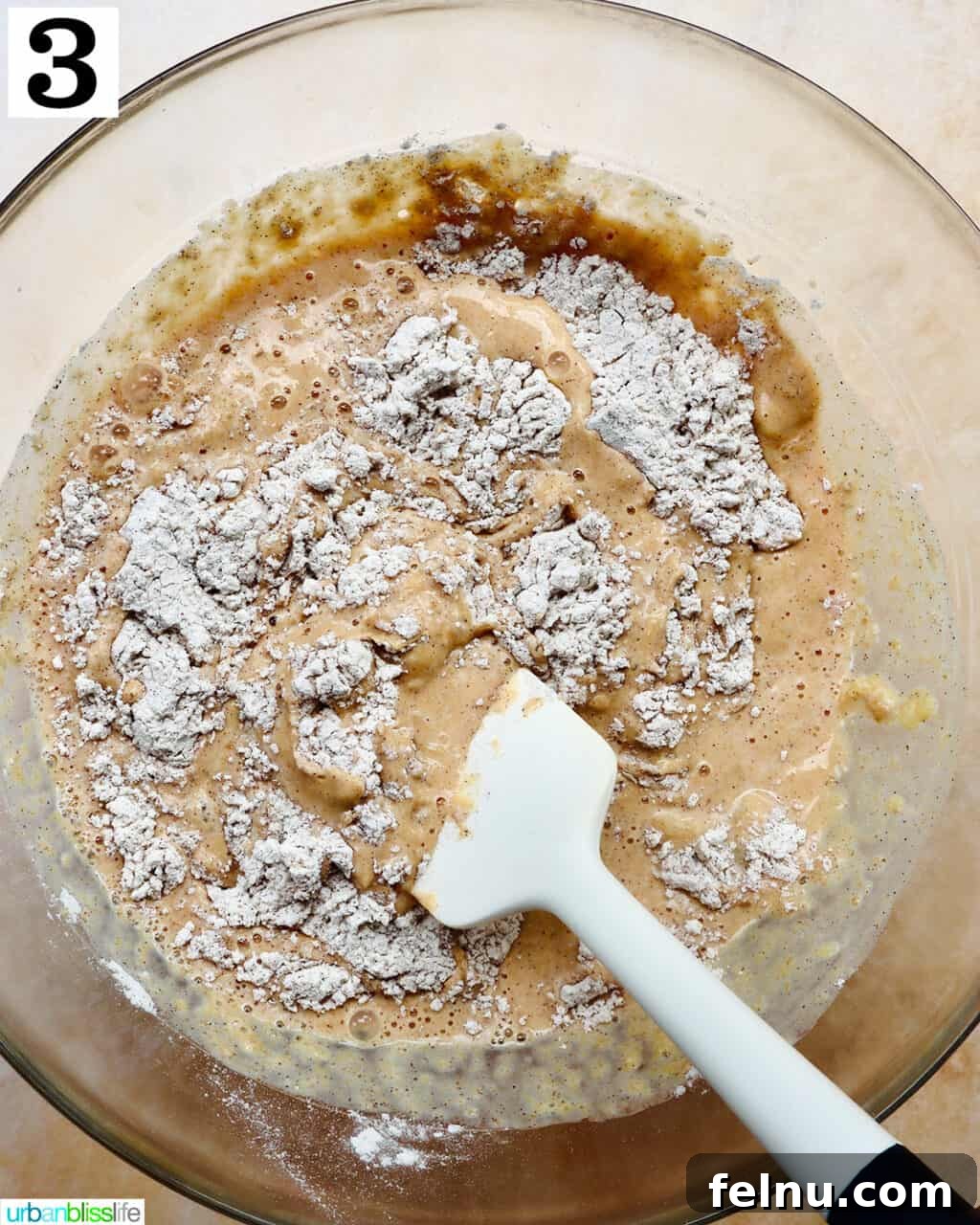 Combining dry and wet ingredients in a bowl.