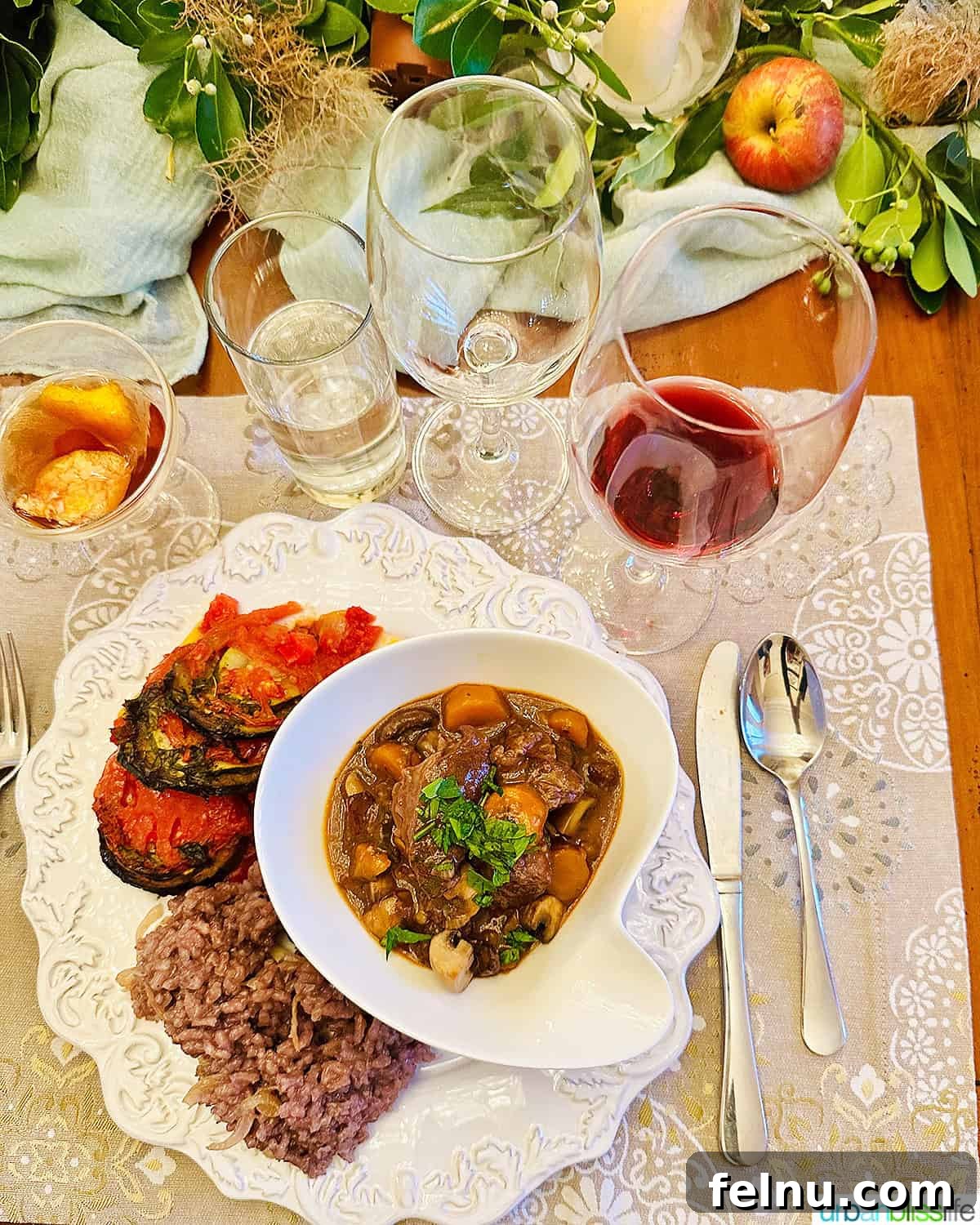 Iconic French Culinary Delights 20 A cozy scene featuring a bowl of rich beef bourguignon alongside a glass of red wine, set within the elegant ambiance of Chateau de Valcreuse.