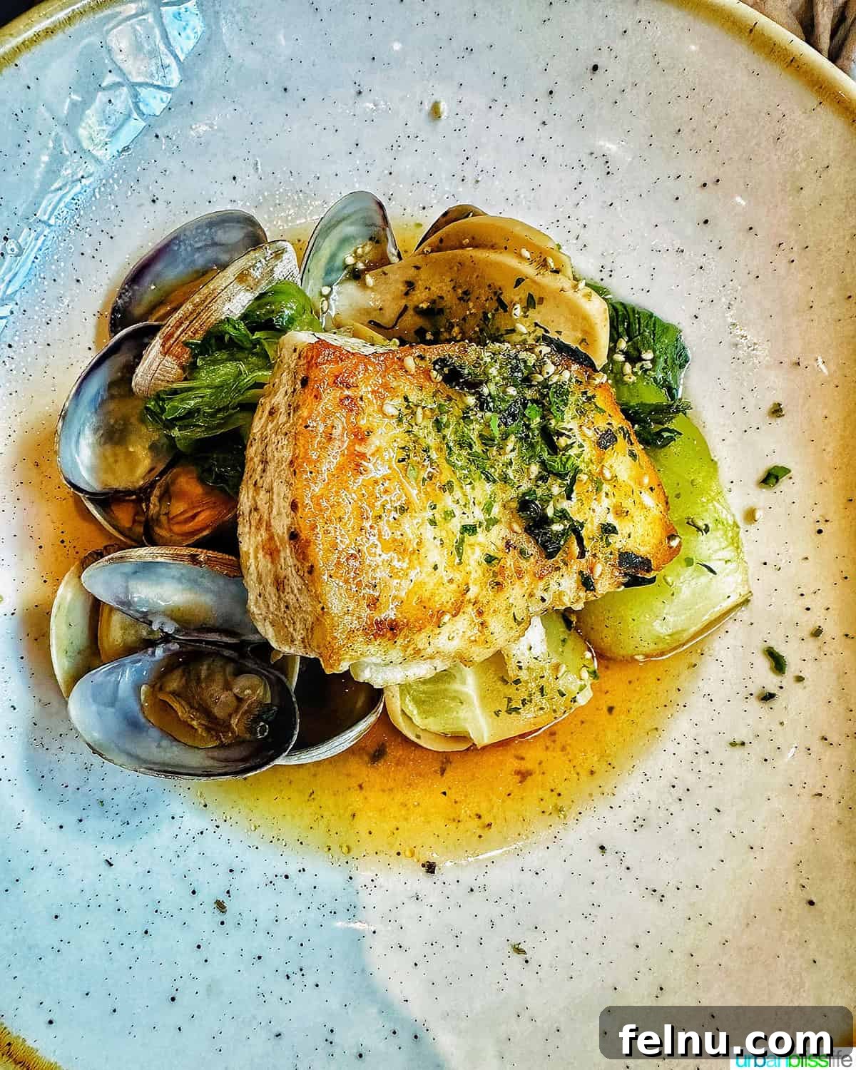 Iconic French Culinary Delights 10 A rustic bowl filled with colorful Bouillabaisse, showcasing a rich broth brimming with various fish and shellfish.