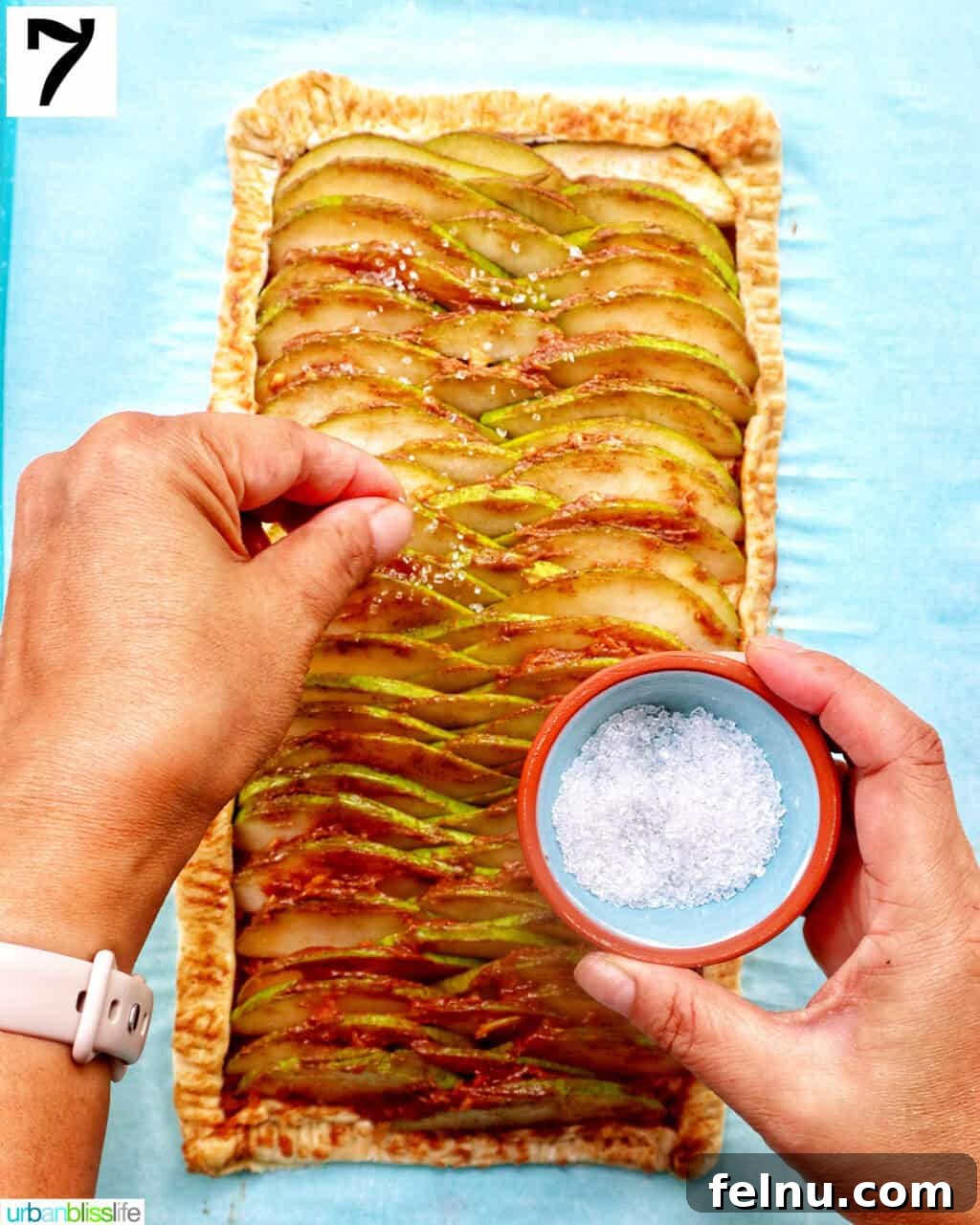 Image showing sanding sugar being sprinkled over the top of the tart.