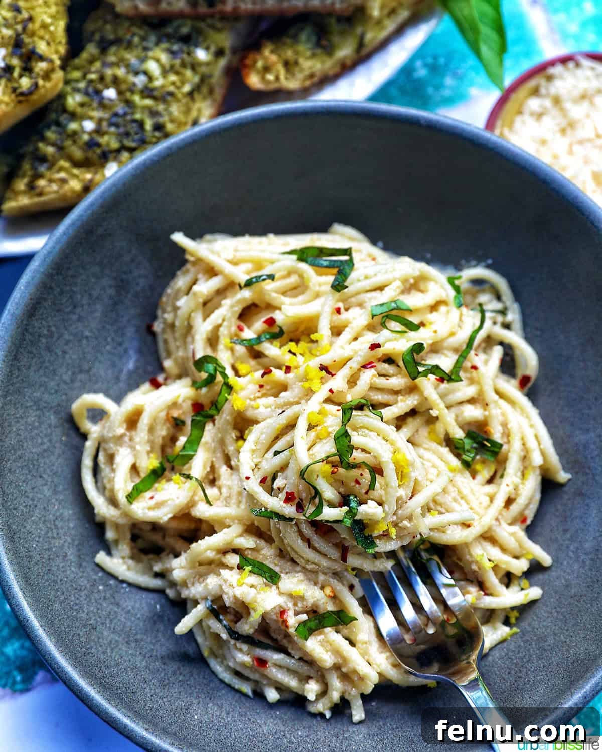 Tahini Sweet Treat 2 Bowl of creamy tahini pasta with a fork, ready to eat.