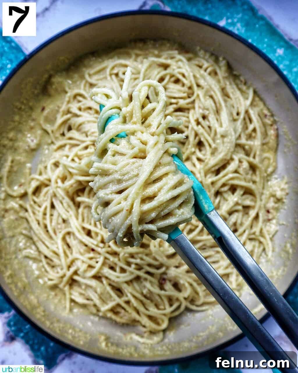 Tahini Sweet Treat 12 Tongs holding up tahini pasta in a pan.