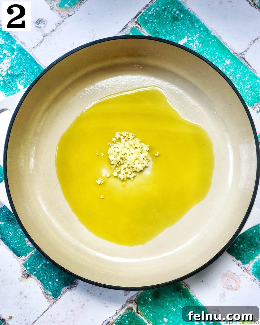 Tahini Sweet Treat 7 Garlic and olive oil sautéing in a saucepan.