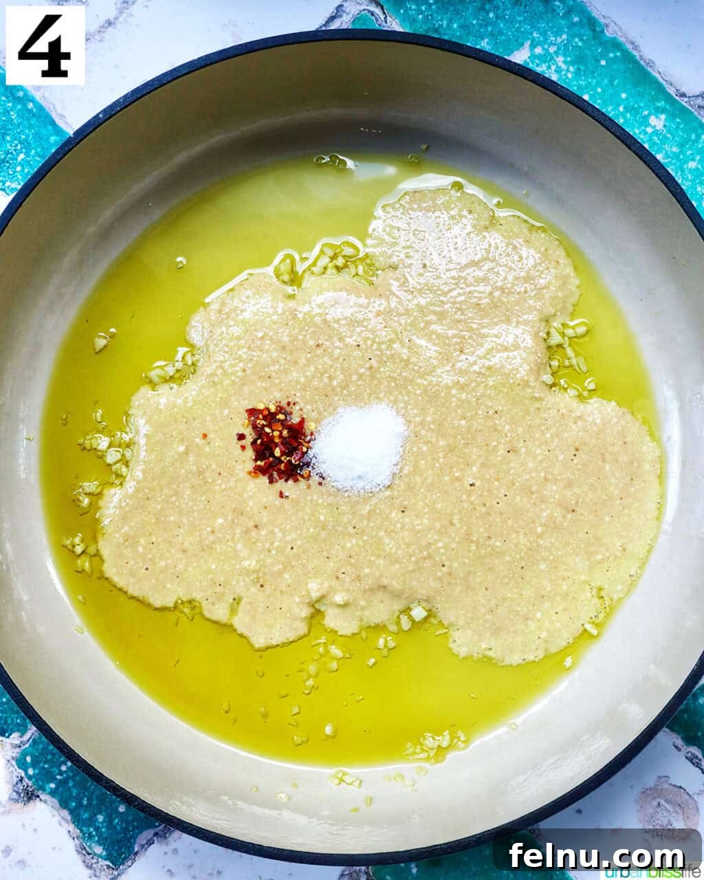 Tahini Sweet Treat 9 Adding tahini and spices to garlic and olive oil in a saucepan.
