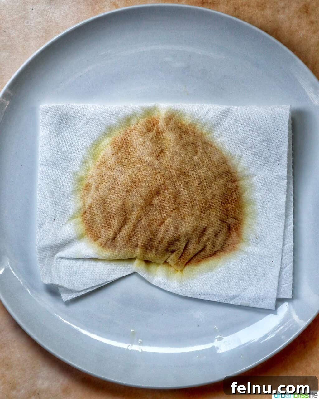 paper towel blotting pumpkin puree