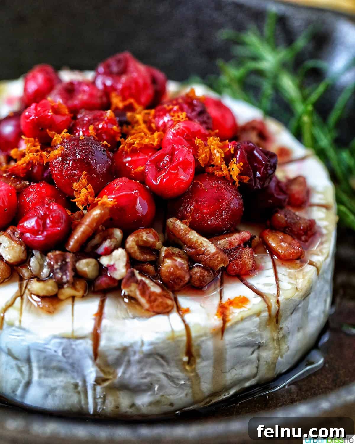 Cranberry and Pecan Crusted Brie 2 Cranberry Pecan Baked Brie served in a skillet.
