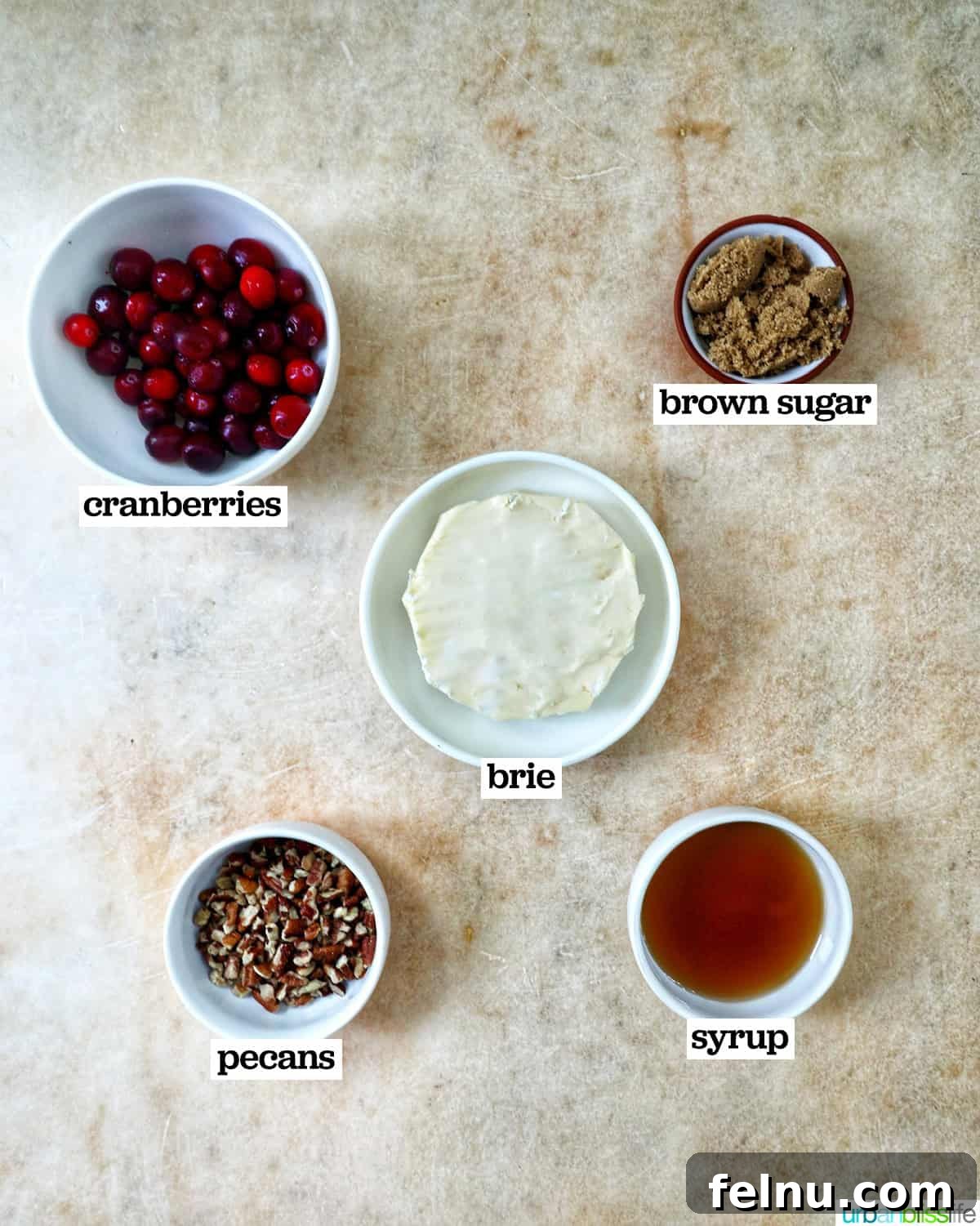 Cranberry and Pecan Crusted Brie 4 Bowls of ingredients to make Cranberry Pecan Baked Brie.