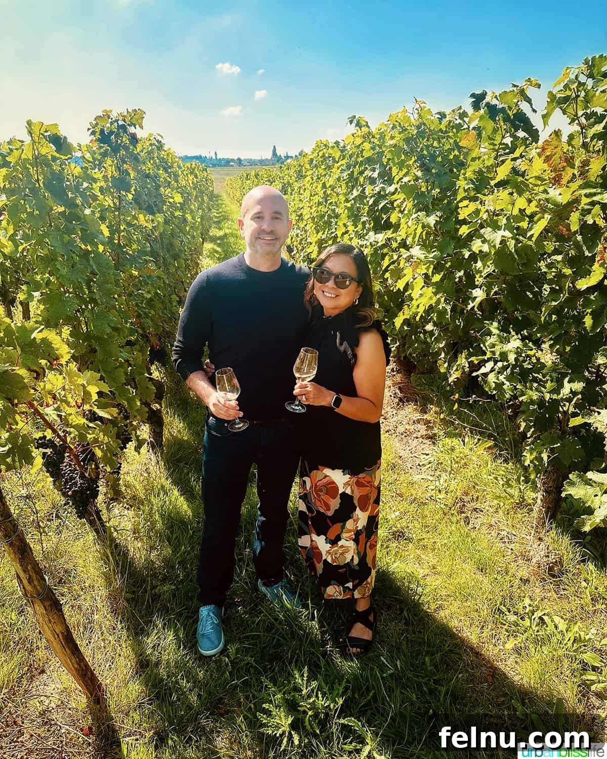 Uncorking the Elegance of Chateau de la Grille 8 Marlynn and Alain enjoying a moment together in the sun-drenched vineyard at Château de la Grille, capturing the essence of a serene visit.