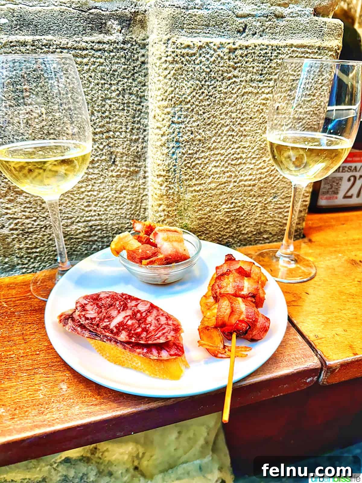 Txakoli Wine Explained: Basque Country's Unique Sip 8 two glasses of txakoli wine with pintxos