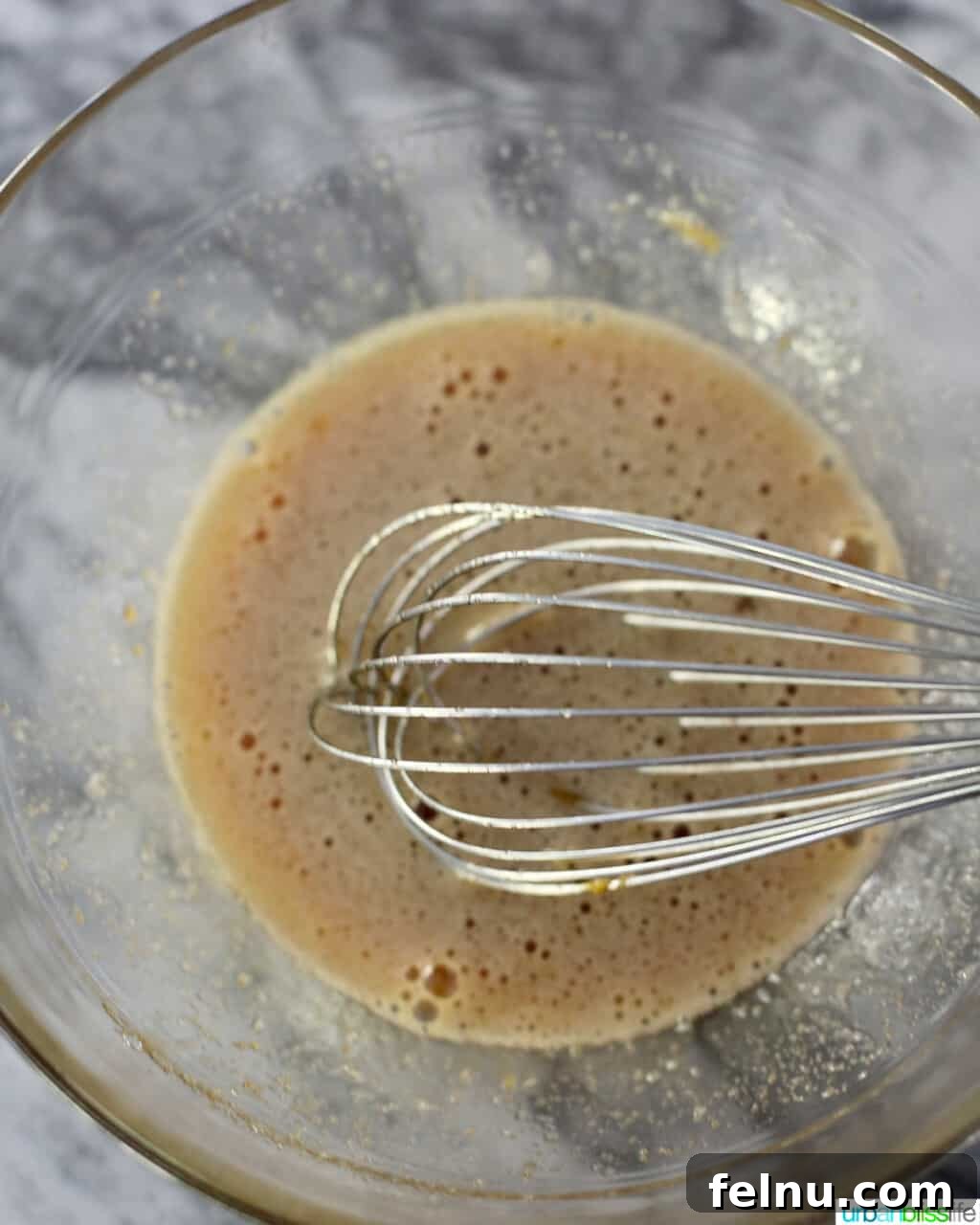 Mini Pecan Tarts 12 Whisking ingredients for mini pecan pies
