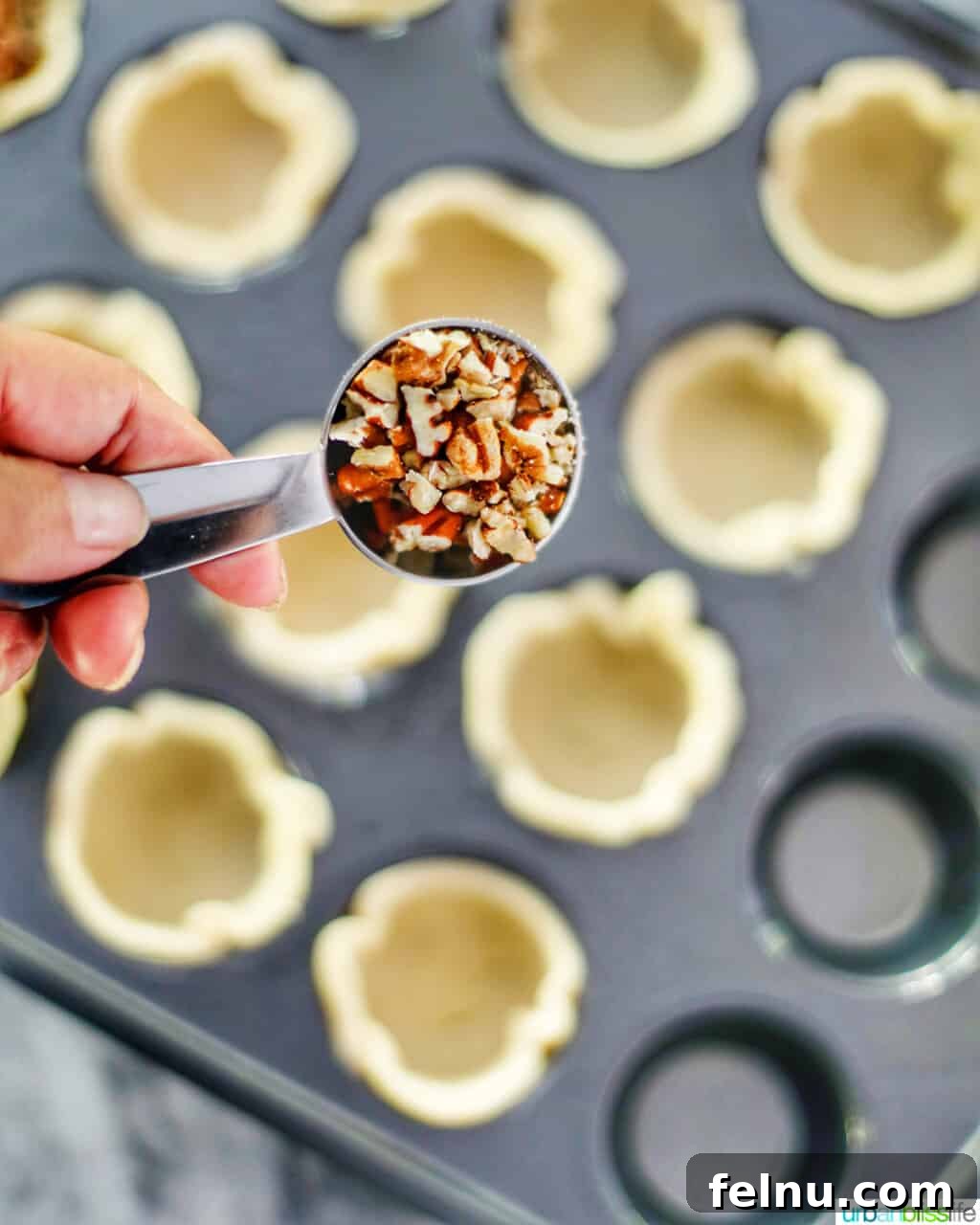 Mini Pecan Tarts 9 Adding pecans into dough