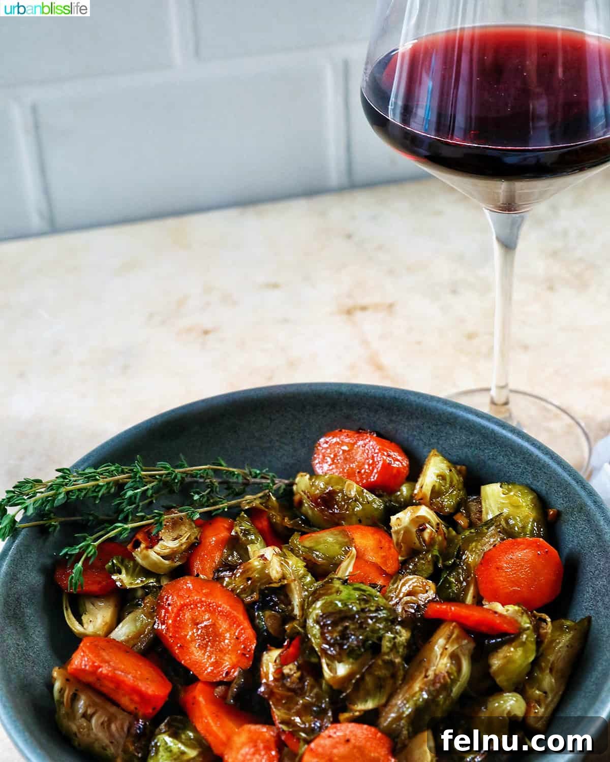 Roasted Brussels Sprouts with Maple-Glazed Carrots 11 Roasted Brussels sprouts and carrot slices paired with a glass of red wine.