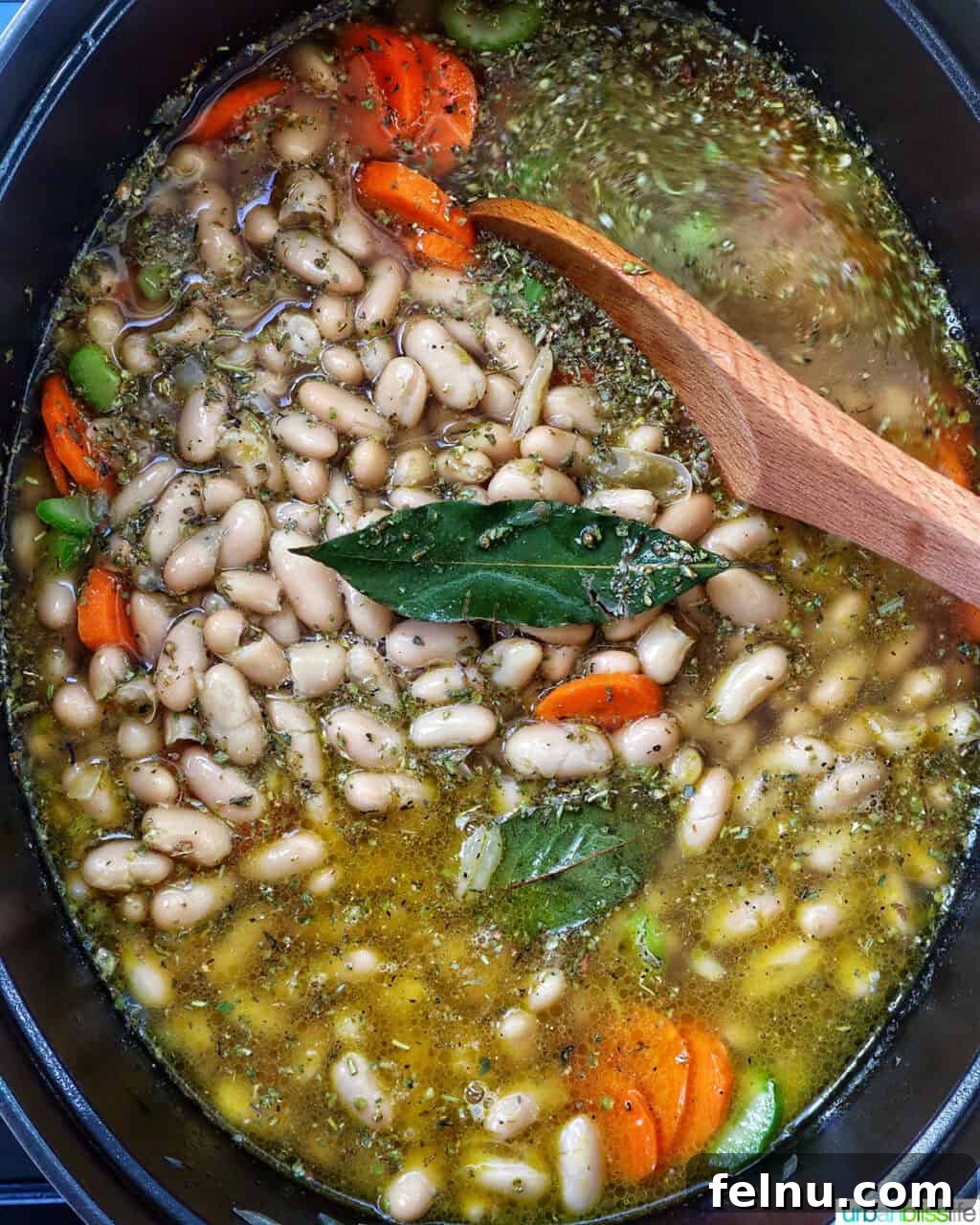 Tuscan Kale and White Bean Soup: A Hearty Italian Classic 11 Tuscan kale and white bean soup in a Dutch oven