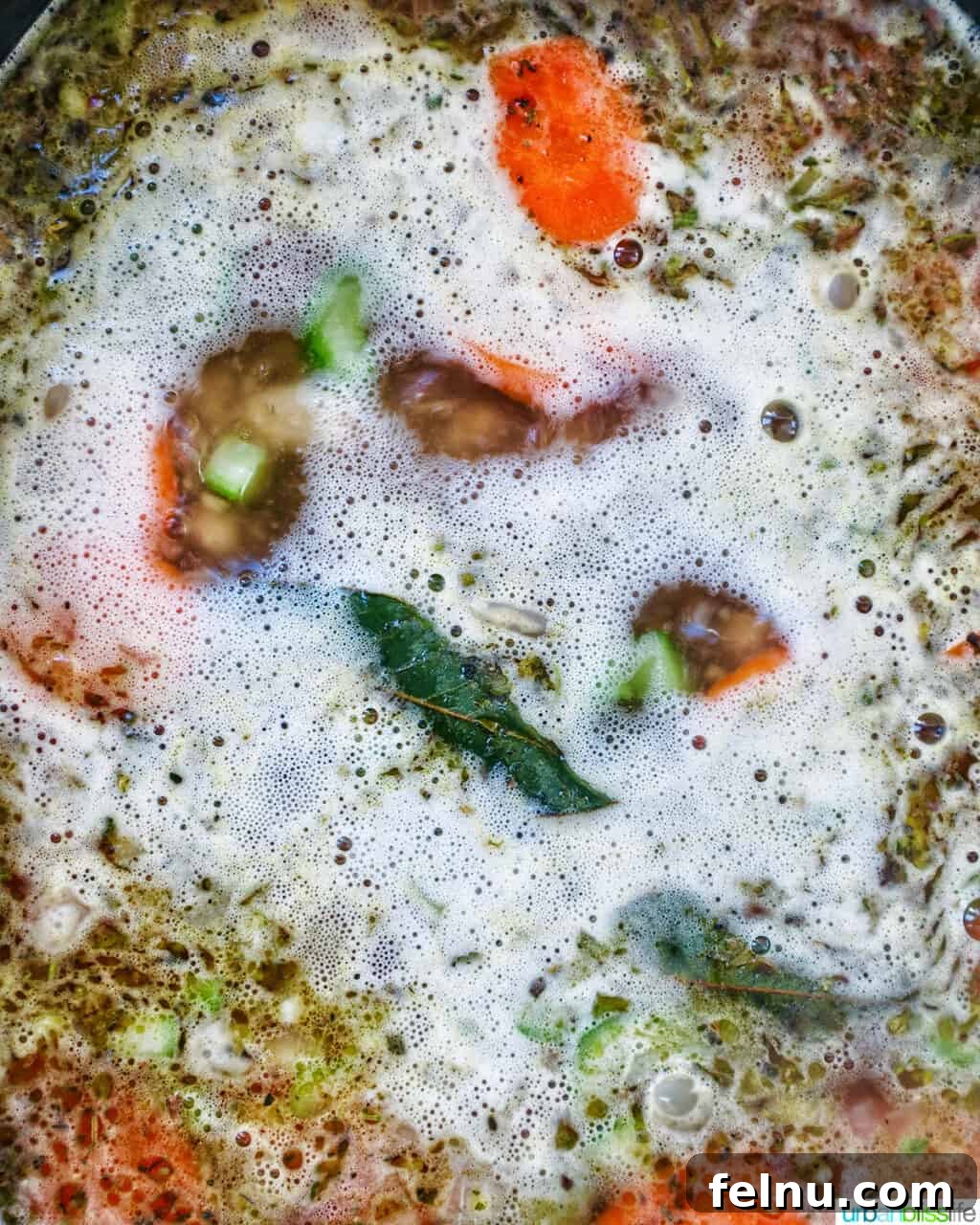 Tuscan Kale and White Bean Soup: A Hearty Italian Classic 12 Tuscan kale and white bean soup boiling in a Dutch oven