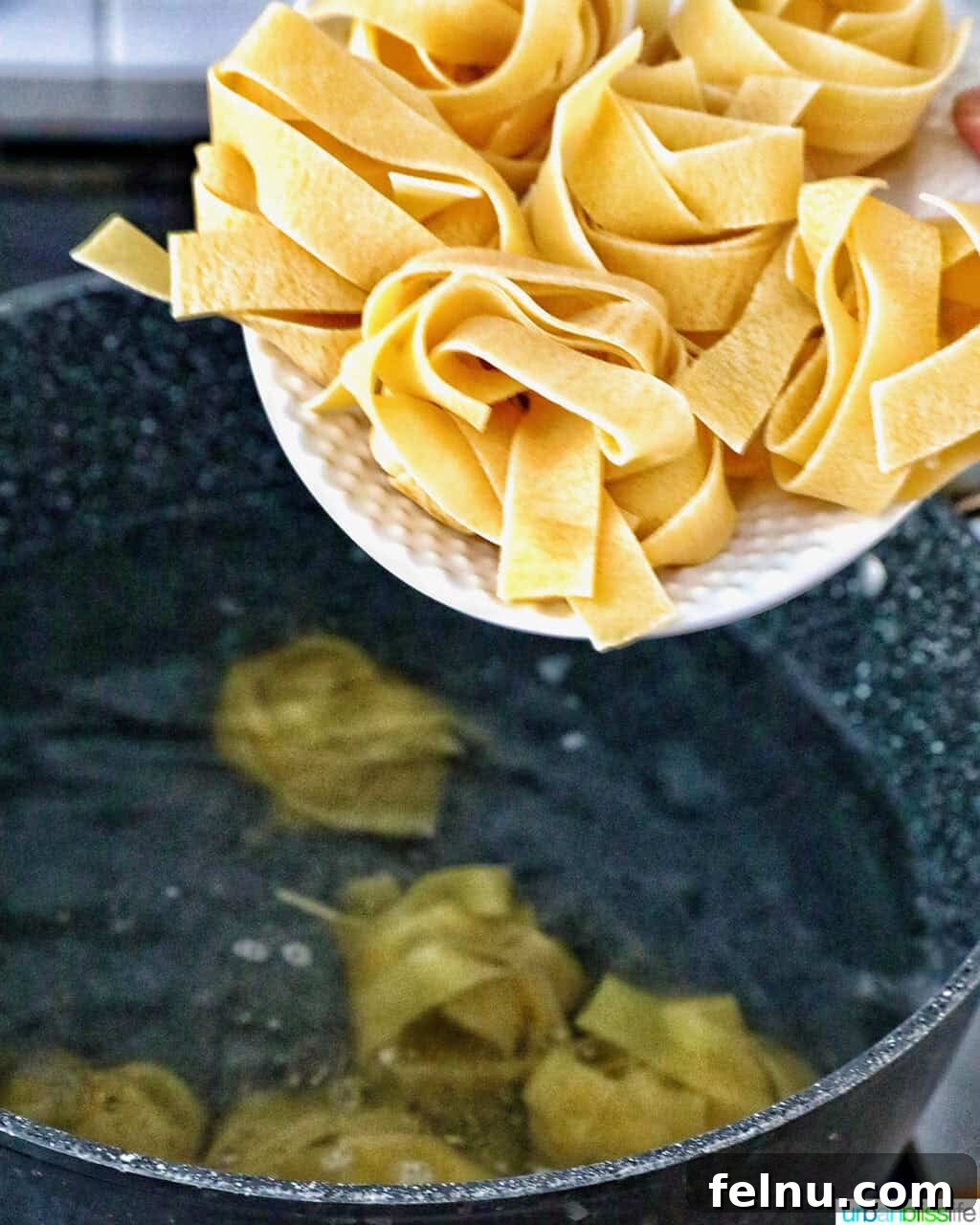 Adding pappardelle to boiling water