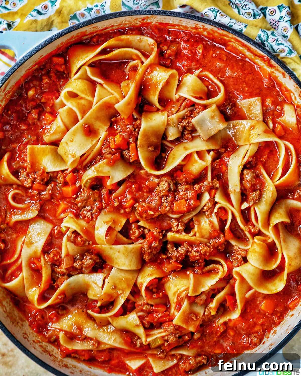 Hearty lamb ragu pappardelle in a pan