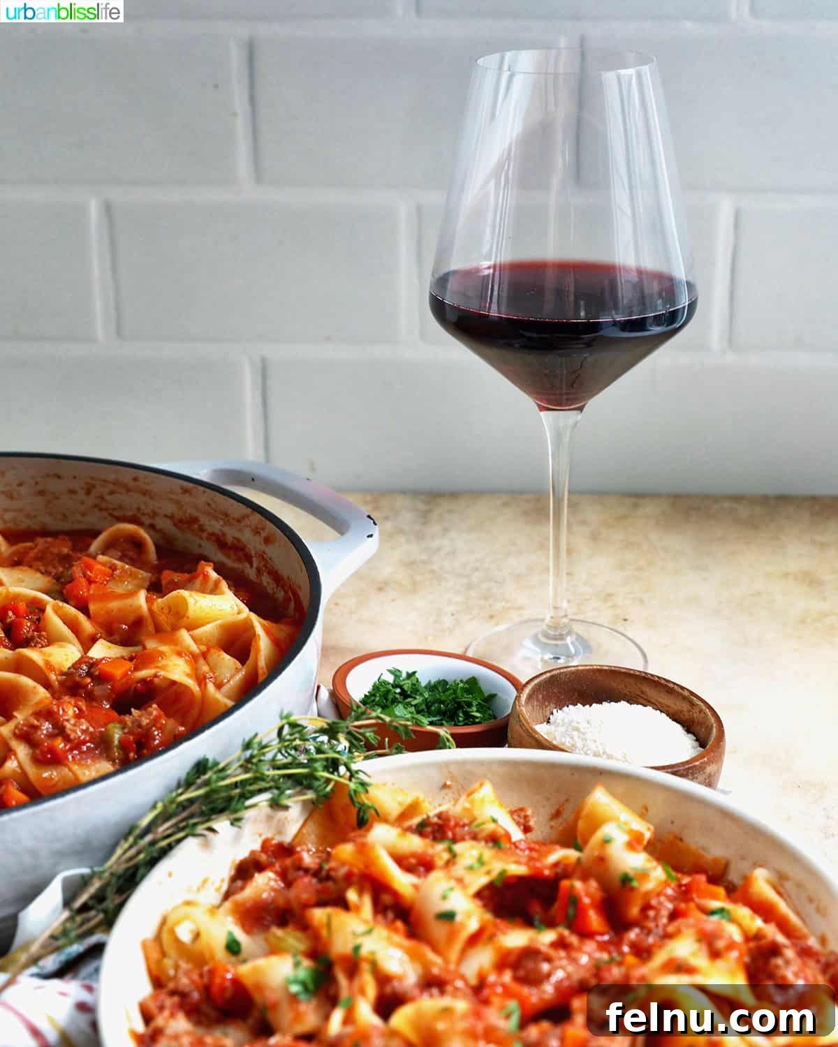 Lamb Ragu Pappardelle with a glass of red wine