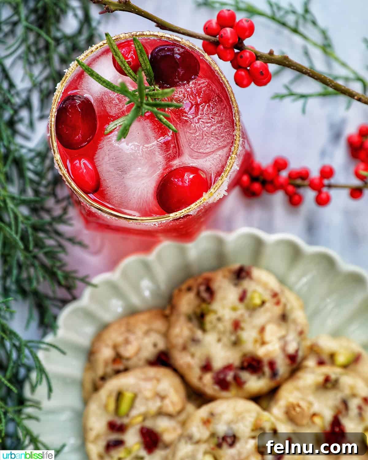 cranberry mocktail with a plate of cranberry pistachio shortbread cookies.