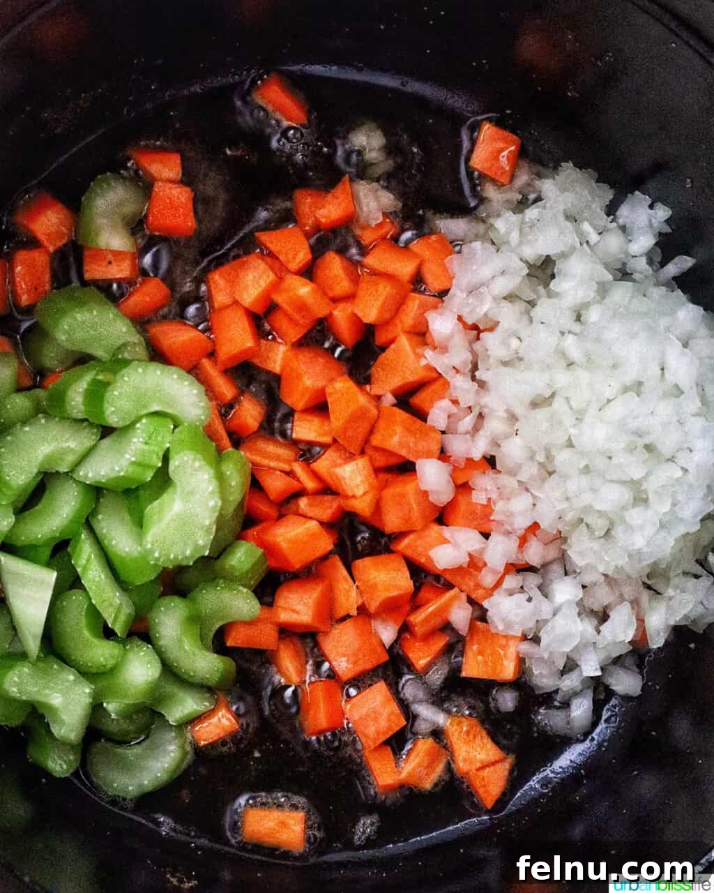 mirepoix of carrots, celery, and onions in a Dutch oven.