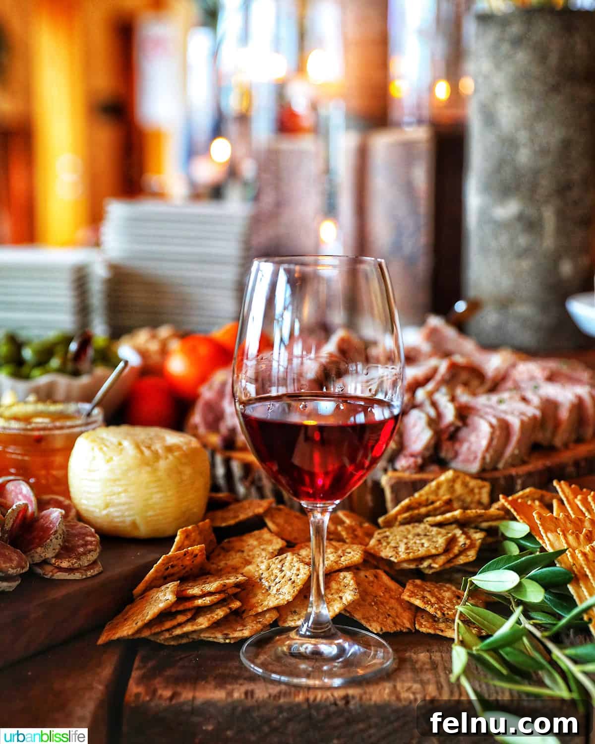 Antipasto Holiday Wreath 16 Glass of red wine on a charcuterie board with meats, cheeses, crackers