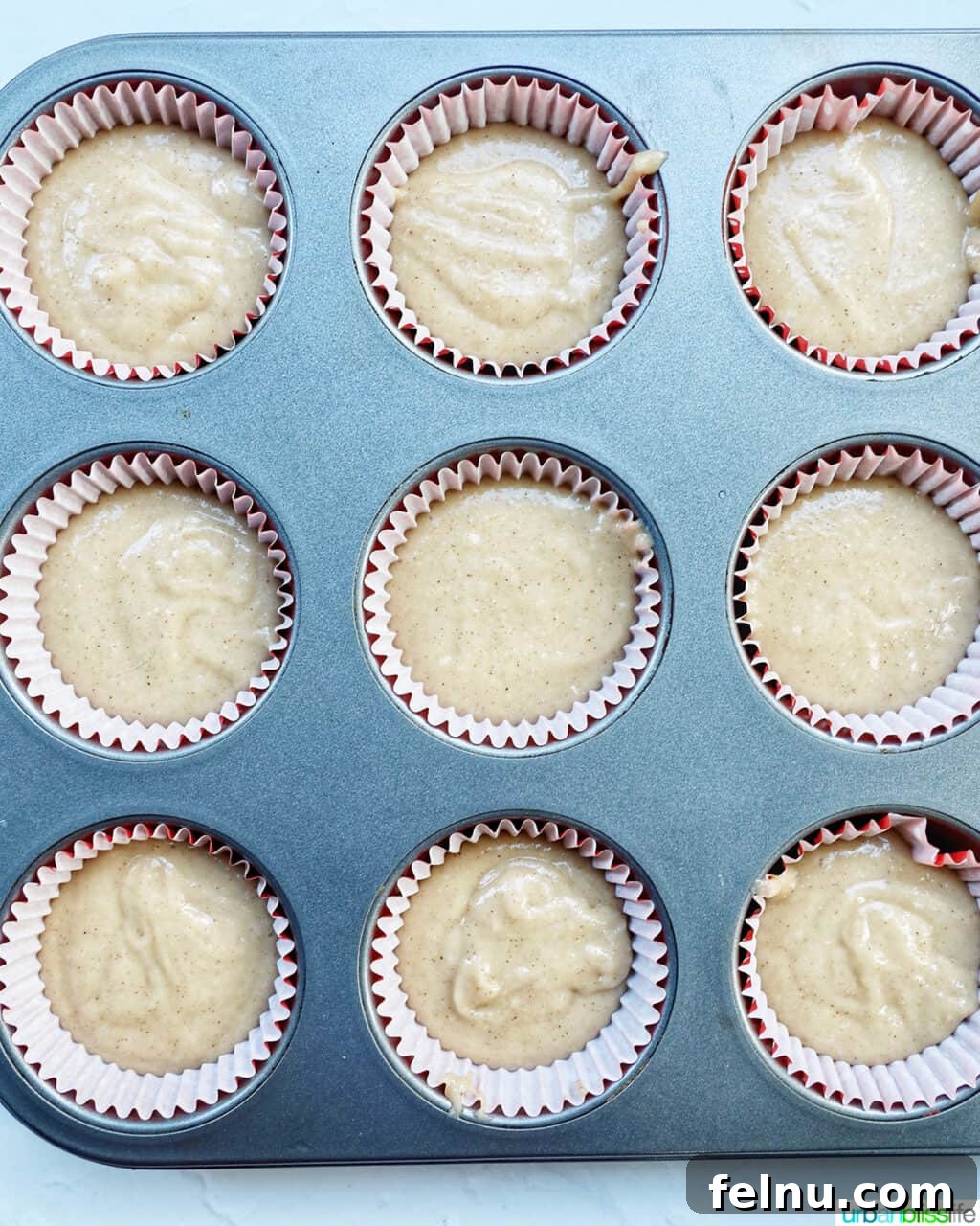 Cinnamon Swirl Delights 12 Cinnamon cupcake batter in cupcake liners ready to bake.