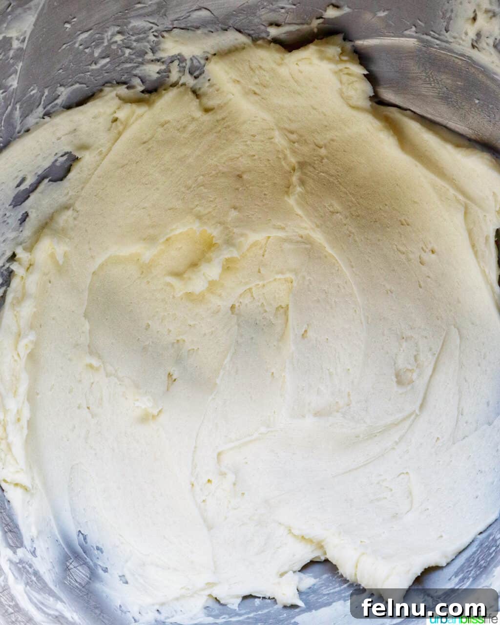 Cinnamon Swirl Delights 15 Creamed butter in a stand mixer bowl.