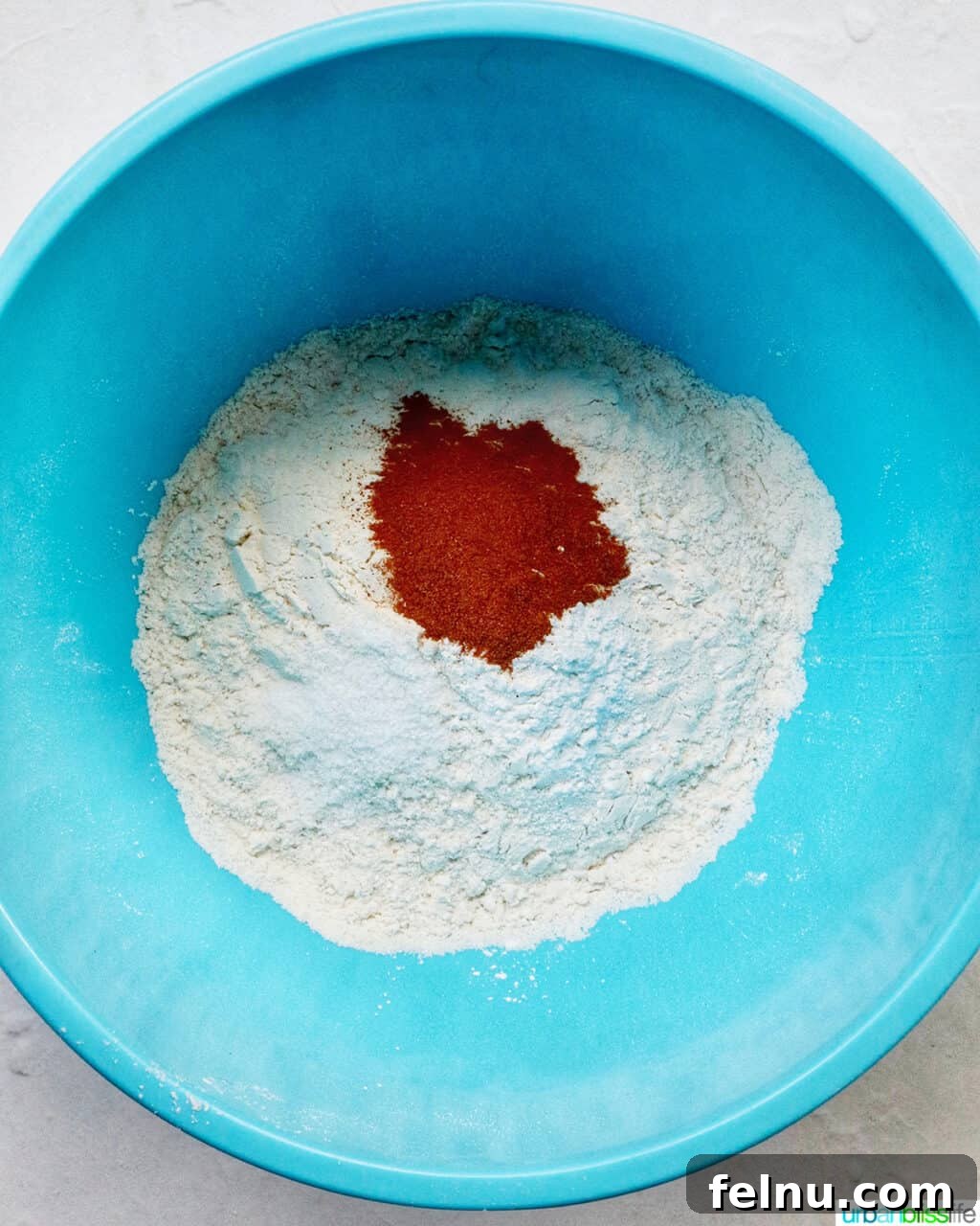 Cinnamon Swirl Delights 6 Dry baking ingredients in a blue bowl.