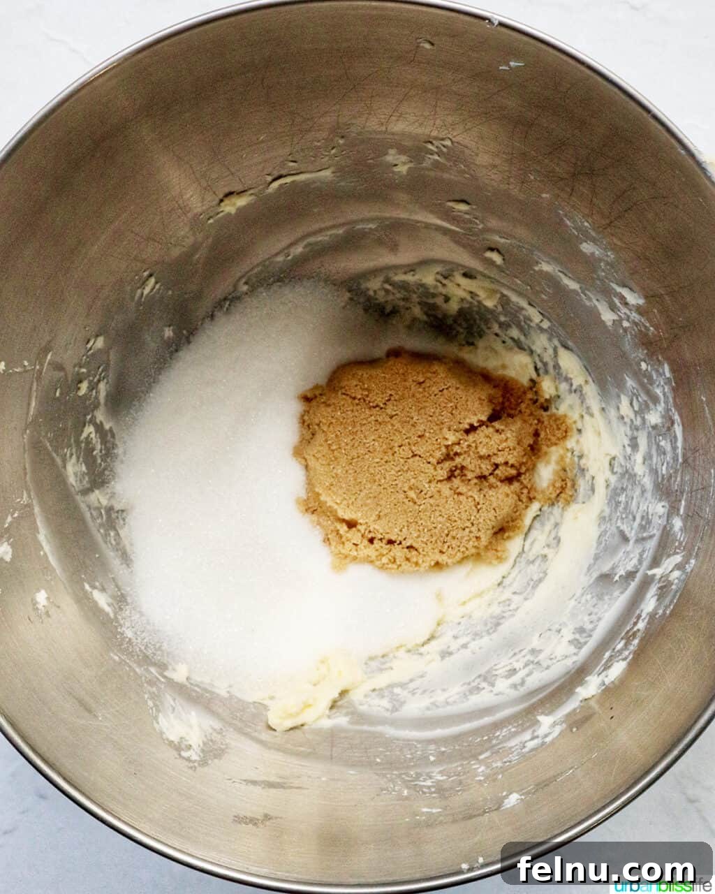 Cinnamon Swirl Delights 8 Brown sugar and white sugar in a stand mixer bowl.