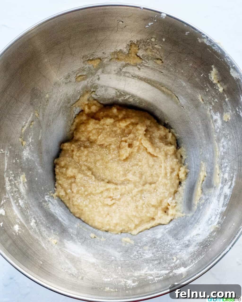 Cinnamon Swirl Delights 10 Cupcake batter in a stand mixer bowl.